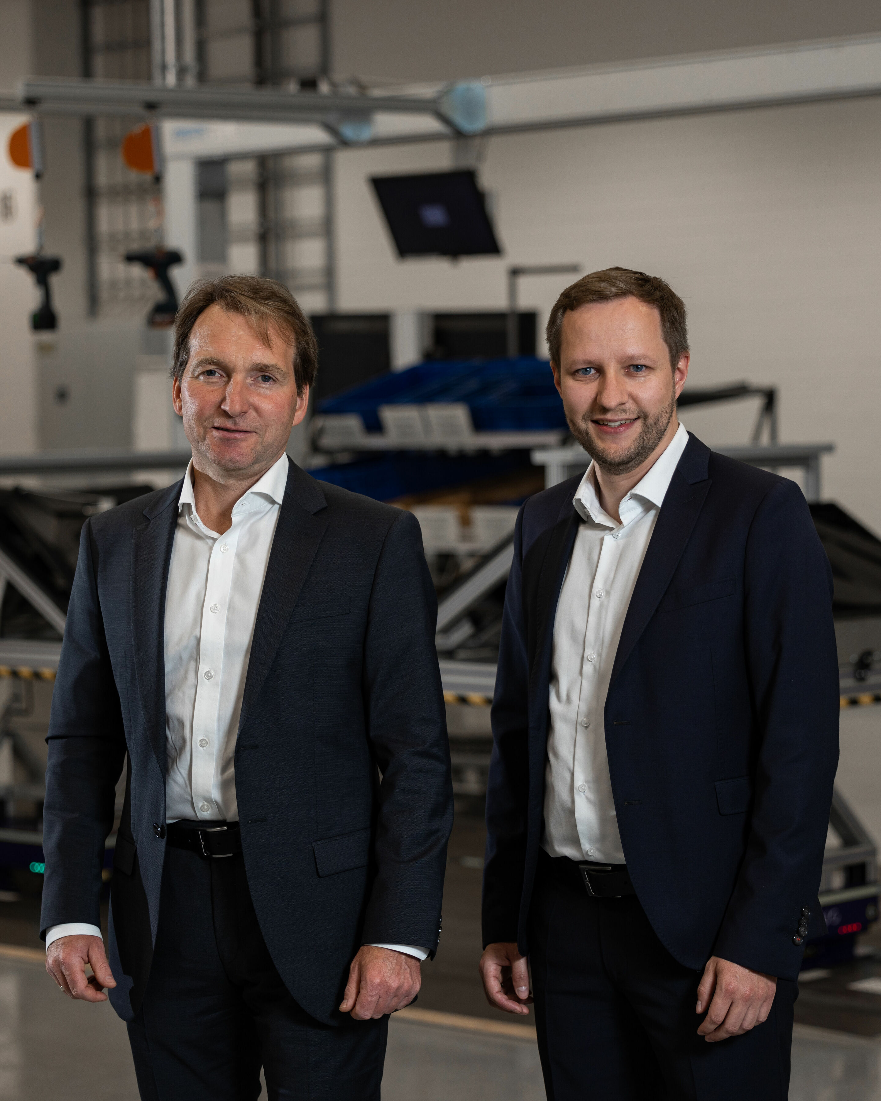 Smart Production - Dr. Josef Weinzierl (Head of Manufacturing Engineering Assembly SSP/MQB/PPE/HV Batteries) and Dr. Ing. Wolfgang Kern (Project Lead “Modular Production” within Audi Production Lab) drive the modular assembly at Audi.
