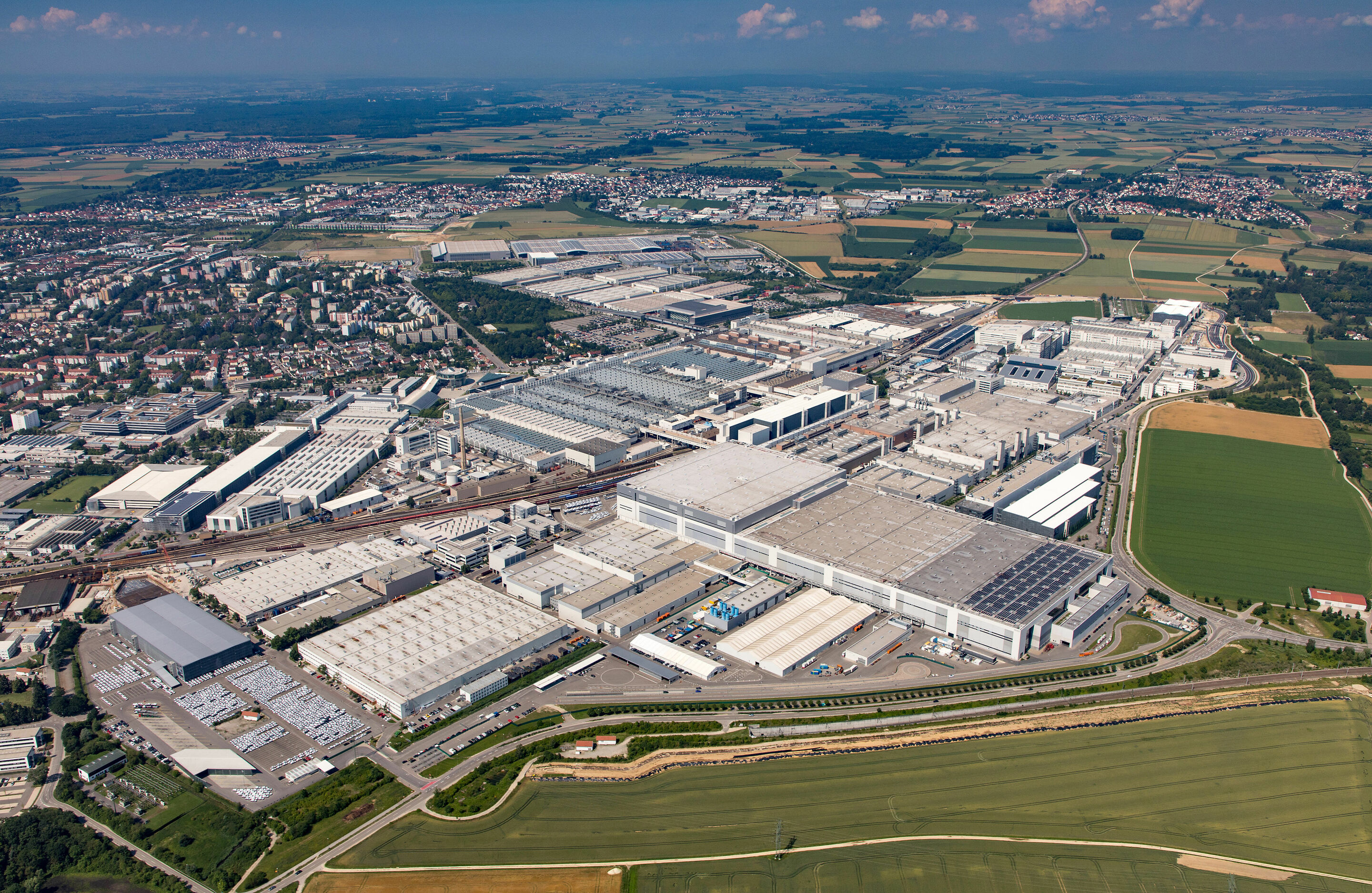 Audi in Ingolstadt (Headquarters) - 2,861,692 m² of floor space: Aerial view of the Audi plant in Ingolstadt, experience it first-hand on a smart guided bus tour