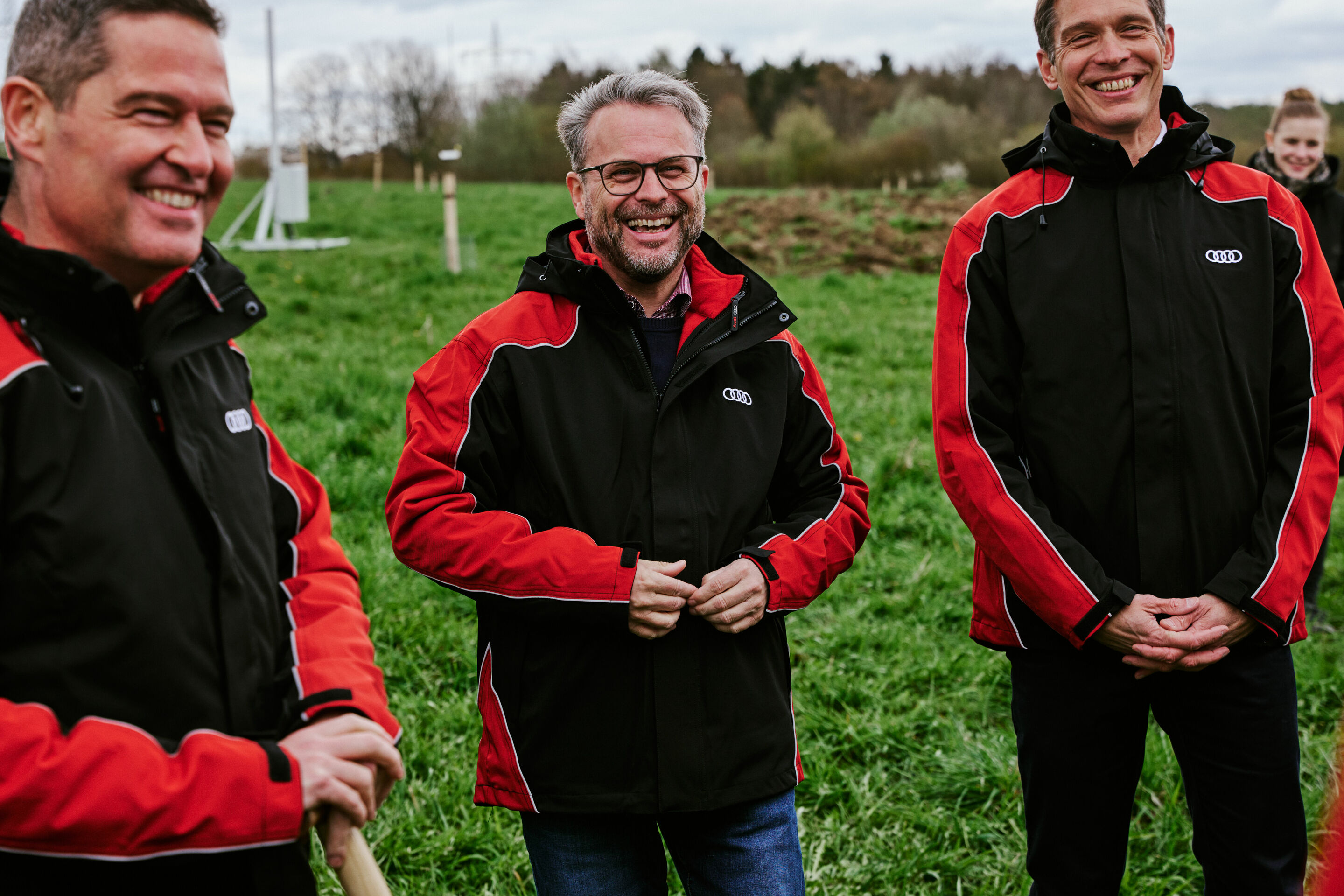 AzuBioTop - Member of the Board of Management for Human Resources Xavier Ros, Chairman of the General Works Council Peter Mosch, and Member of the Board of Management for Production Gerd Walker (from left to right) plant native fruit trees together with...