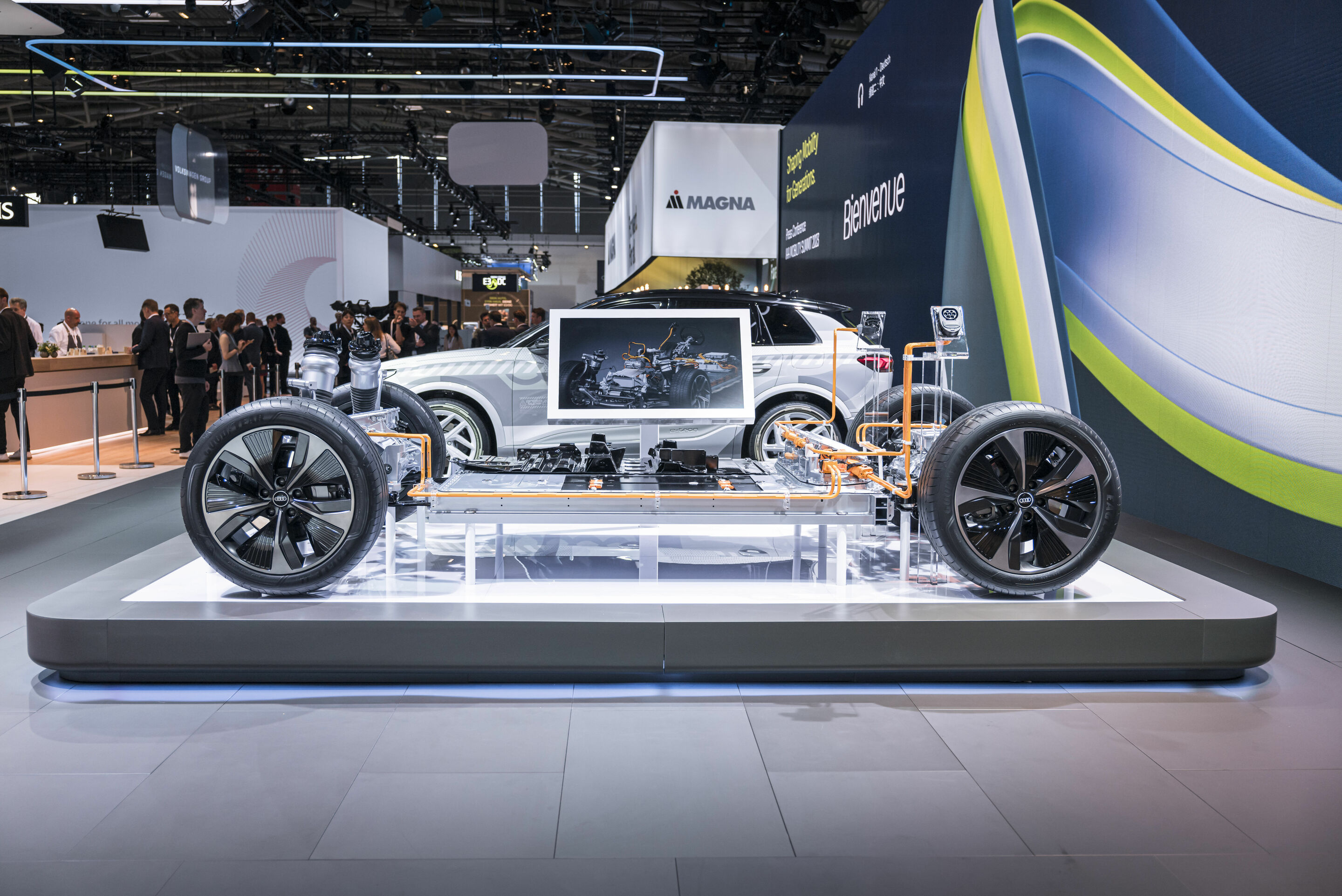 IAA Summit 2023 - The upcoming Audi Q6 e-tron model series is the first to be based on the new Premium Platform Electric (PPE). In the background: the masked prototype of the Audi Q6 e-tron