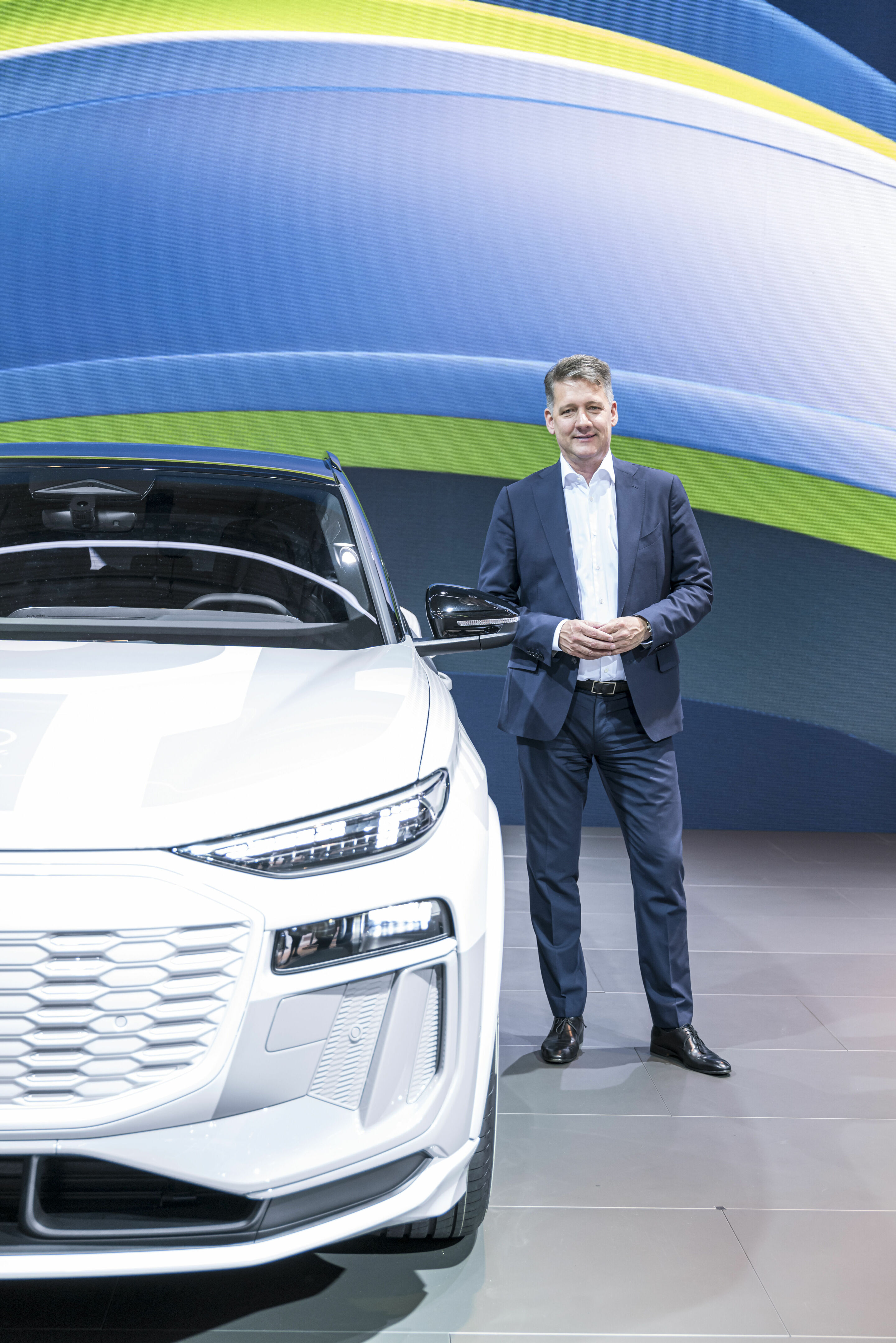 IAA Summit 2023 - Gernot Döllner, Chairman of the Board of Management of AUDI AG, with the masked prototype of the Audi Q6 e-tron