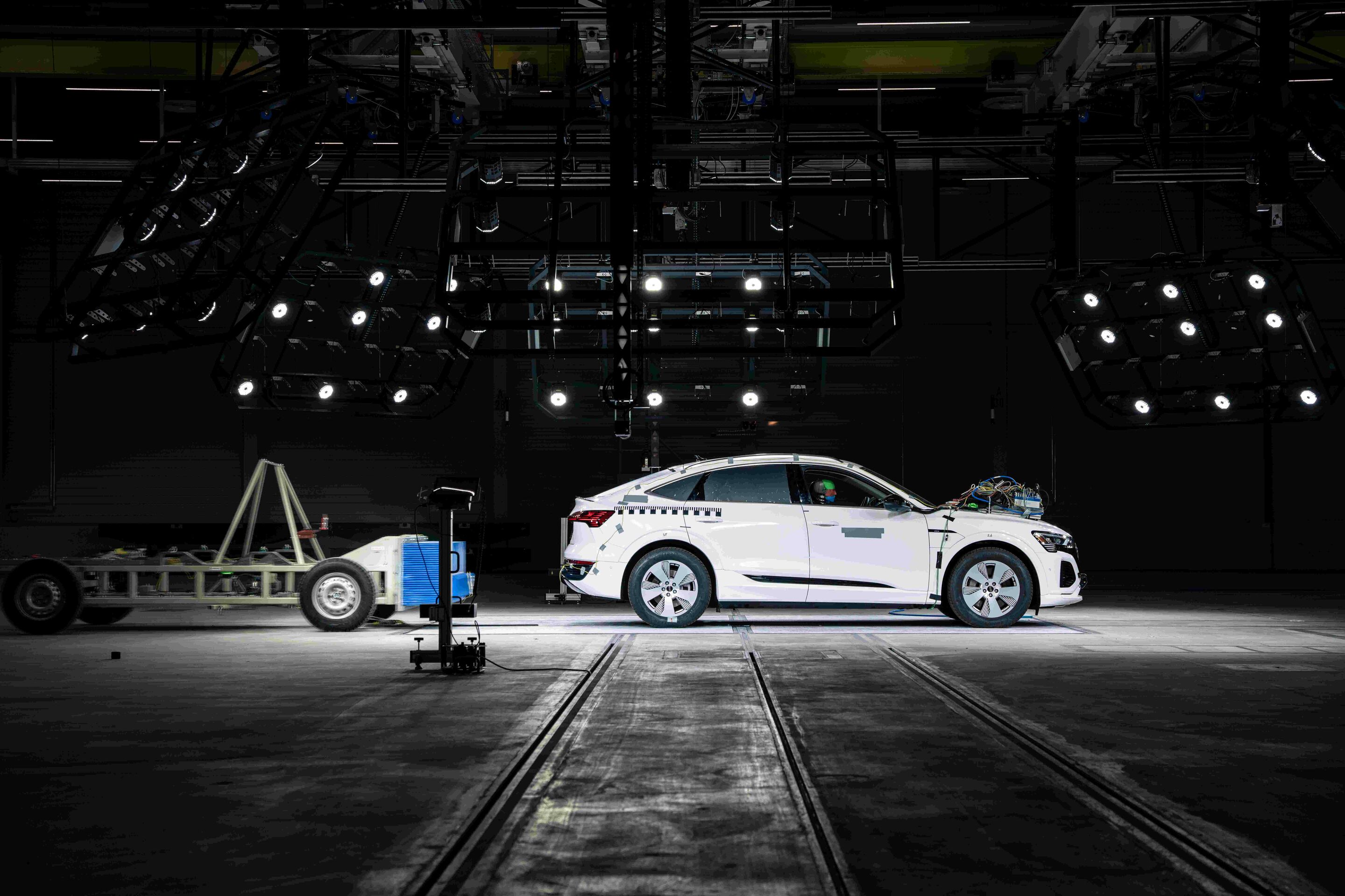 Audi opens new Vehicle Safety Center - Fast rear-end crash: The mobile deformable barrier hits the vehicle at 80 km/h.