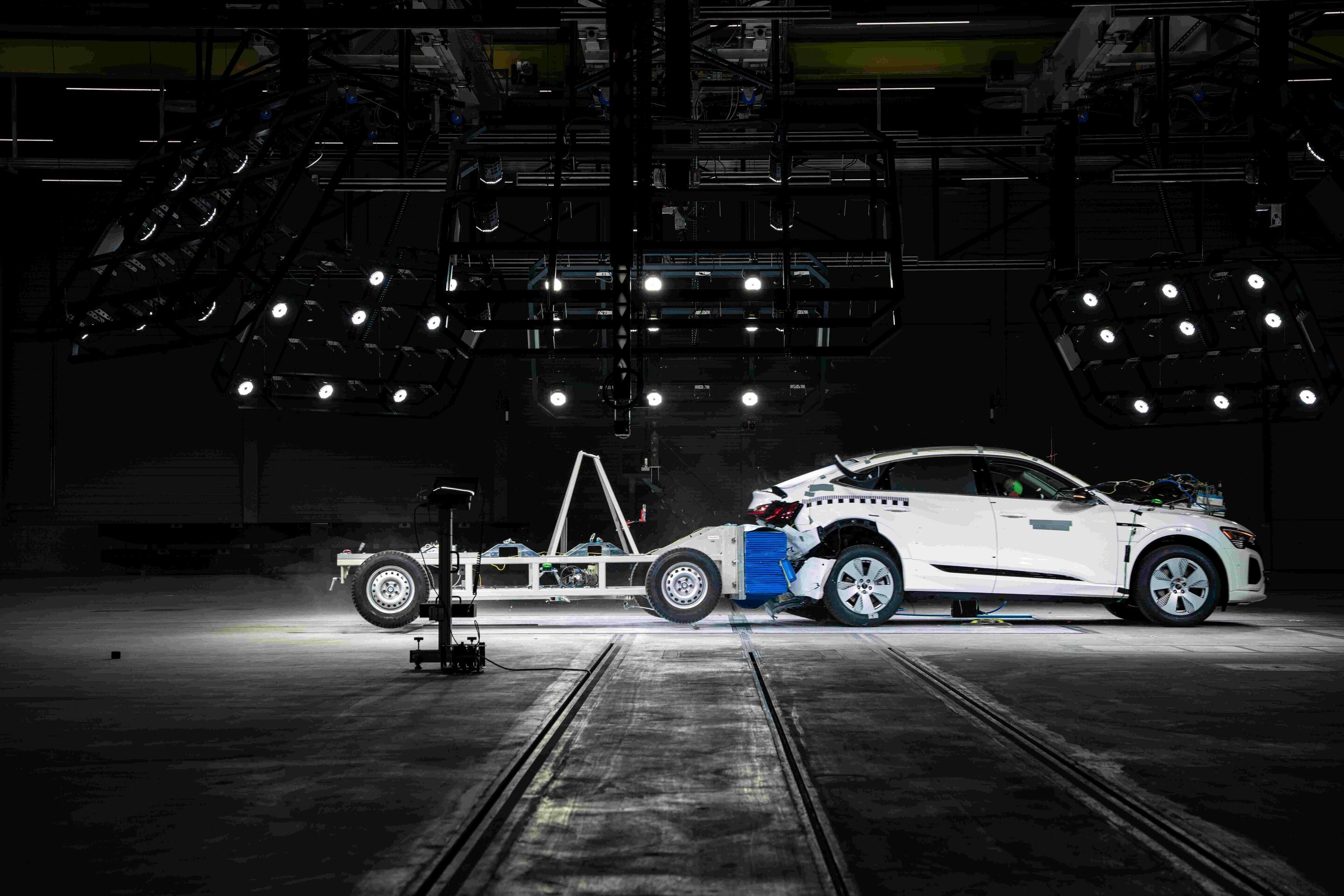 Audi opens new Vehicle Safety Center - Fast rear-end crash: The mobile deformable barrier hits the vehicle at 80 km/h.
