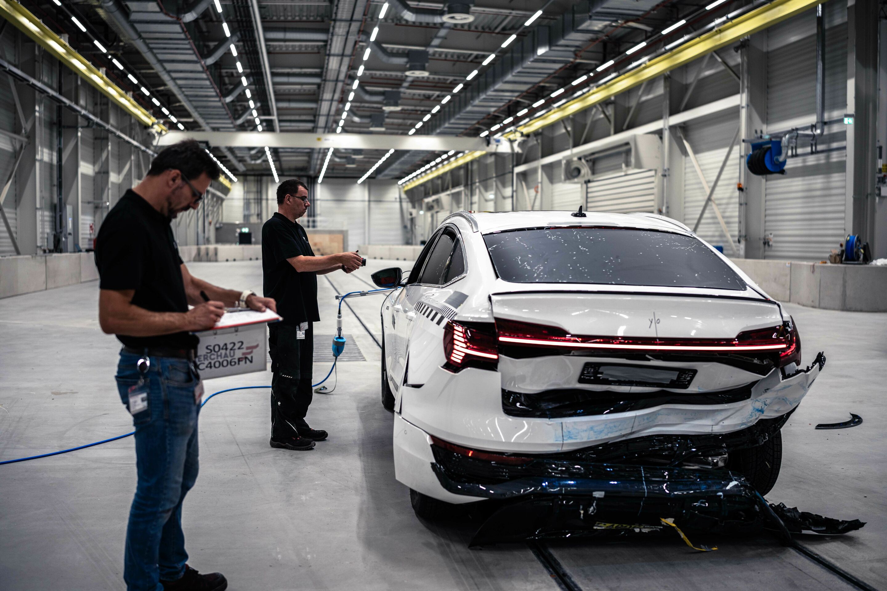Audi opens new Vehicle Safety Center - Fast rear-end crash: The mobile deformable barrier hits the vehicle at 80 km/h.
