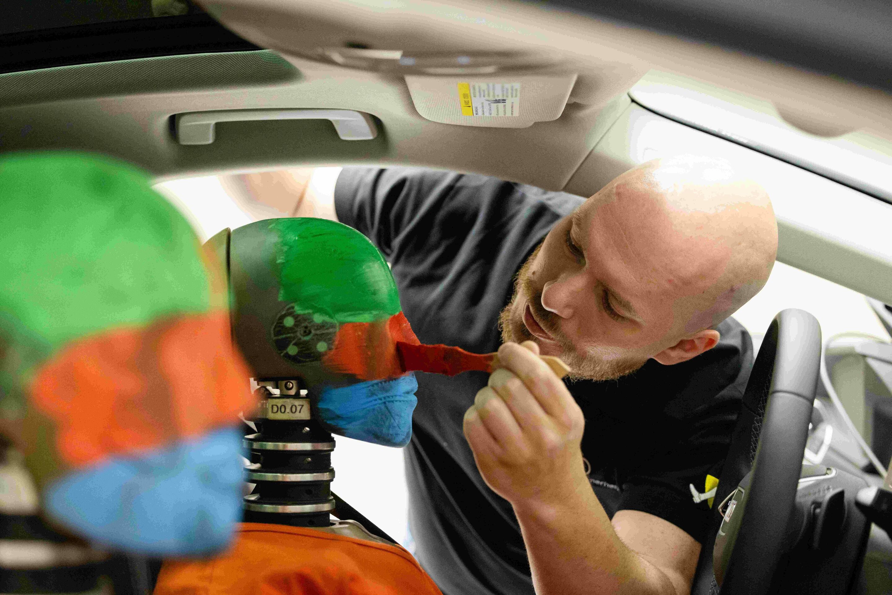 Audi opens new Vehicle Safety Center - Two crash-test dummies being prepared for a crash test at the new Vehicle Safety Center