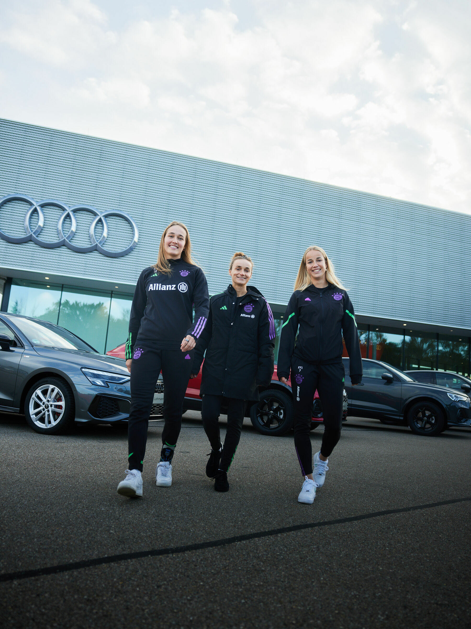 Audi vehicle handover to the FC Bayern Munich women's team - (From left to right): Soccer players Sydney Lohmann, Lina Magull, and Giulia Gwinn during the vehicle handover at the Audi driving experience center in Neuburg an der Donau.