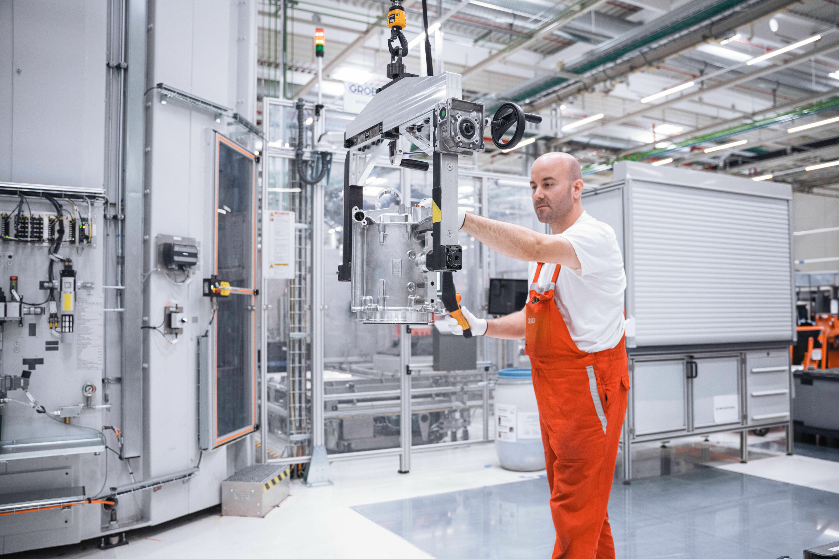 Audi begins production of electric motors for the PPE in Győr - In Győr, Hungary, around 700 Audi employees manufacture electric motors for the Premium Platform Electric (PPE). Pictured: stator transport via crane