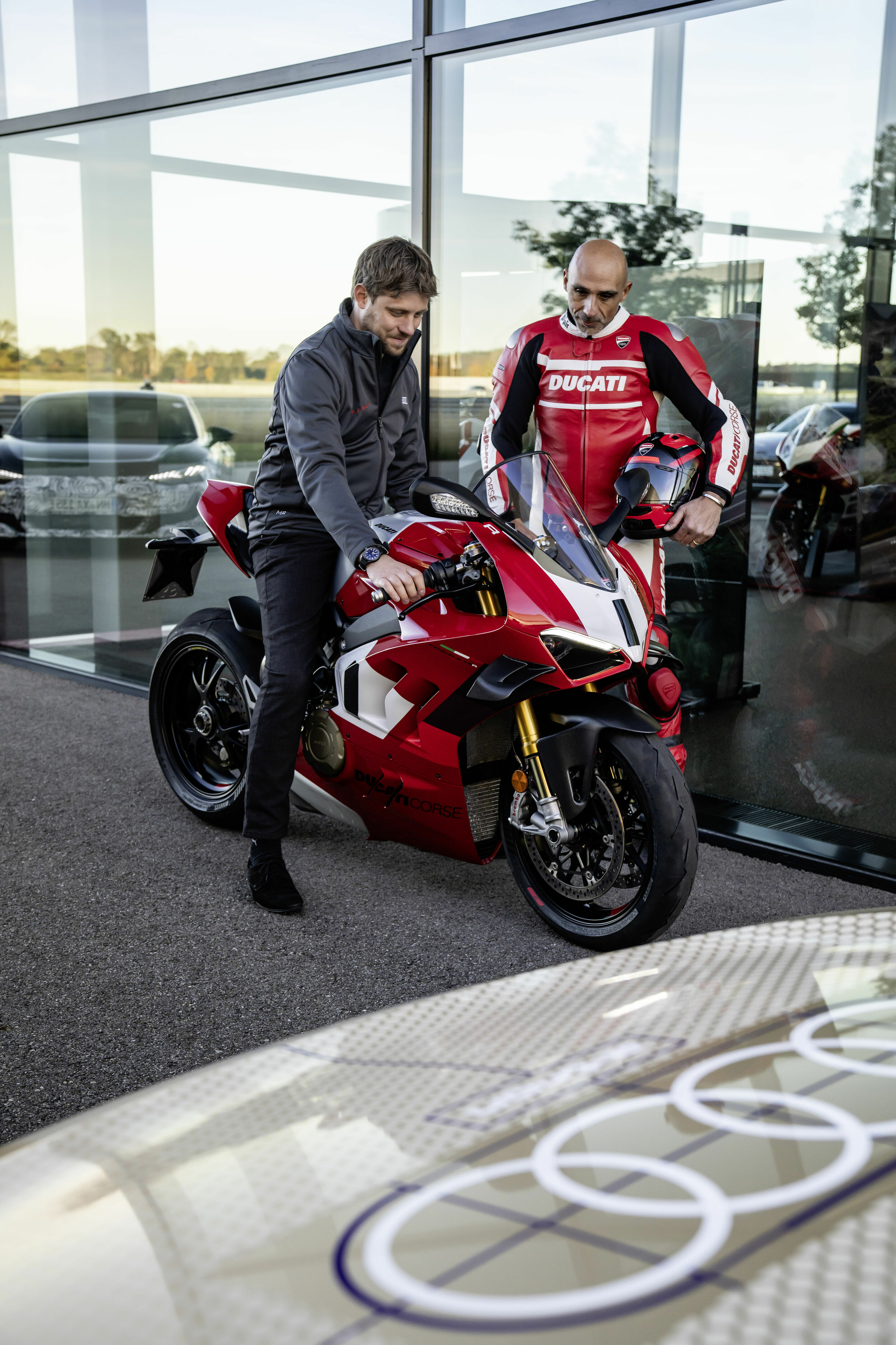 Audi e-tron GT prototype - Jaan Mattes Reiling, Technical Project Manager at Audi in Neckarsulm, is looking forward to a ride on the Ducati Panigale V4 R. Ducati chief tester Alessandro Valia explains the bike.