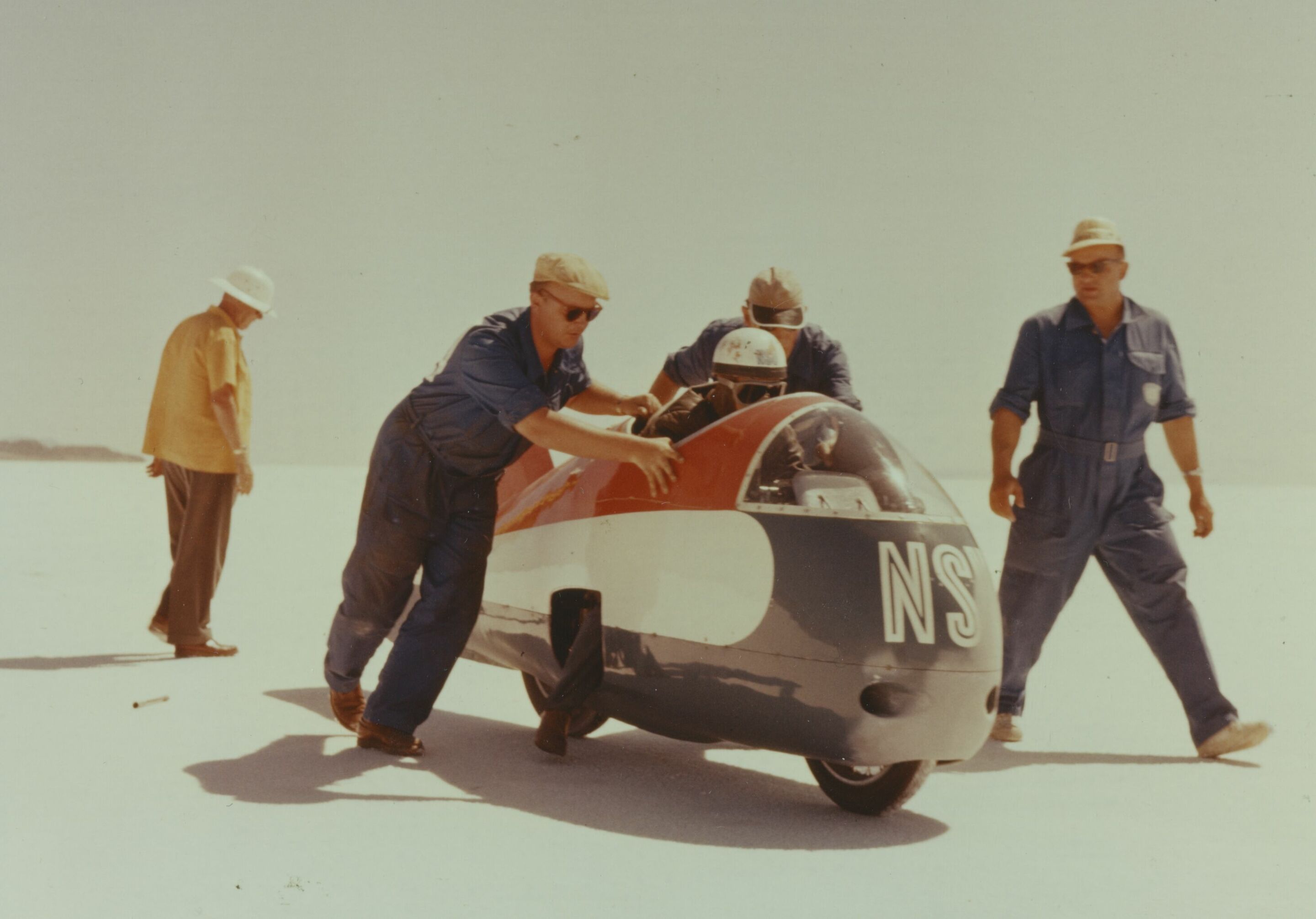 Record-breaking aerodynamics - In 1956, Wilhelm Herz set the outright world speed record for motorcycles on the record-breaking Dolphin III at 339 km/h (211 mph) on a Utah salt lake.