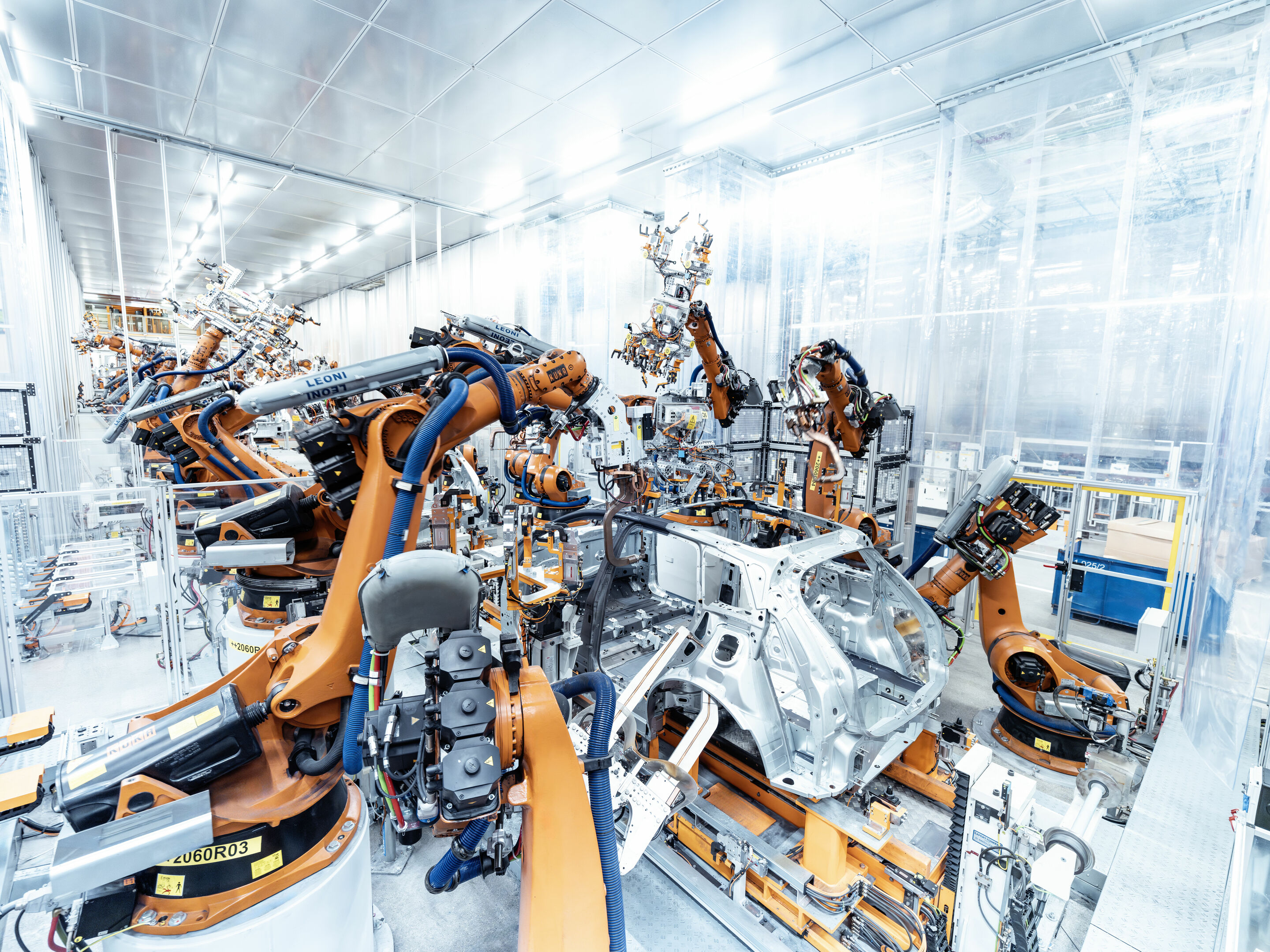 Production Audi Q6 e-tron at the Ingolstadt site - Robots spot weld sheet metal in the body shop.