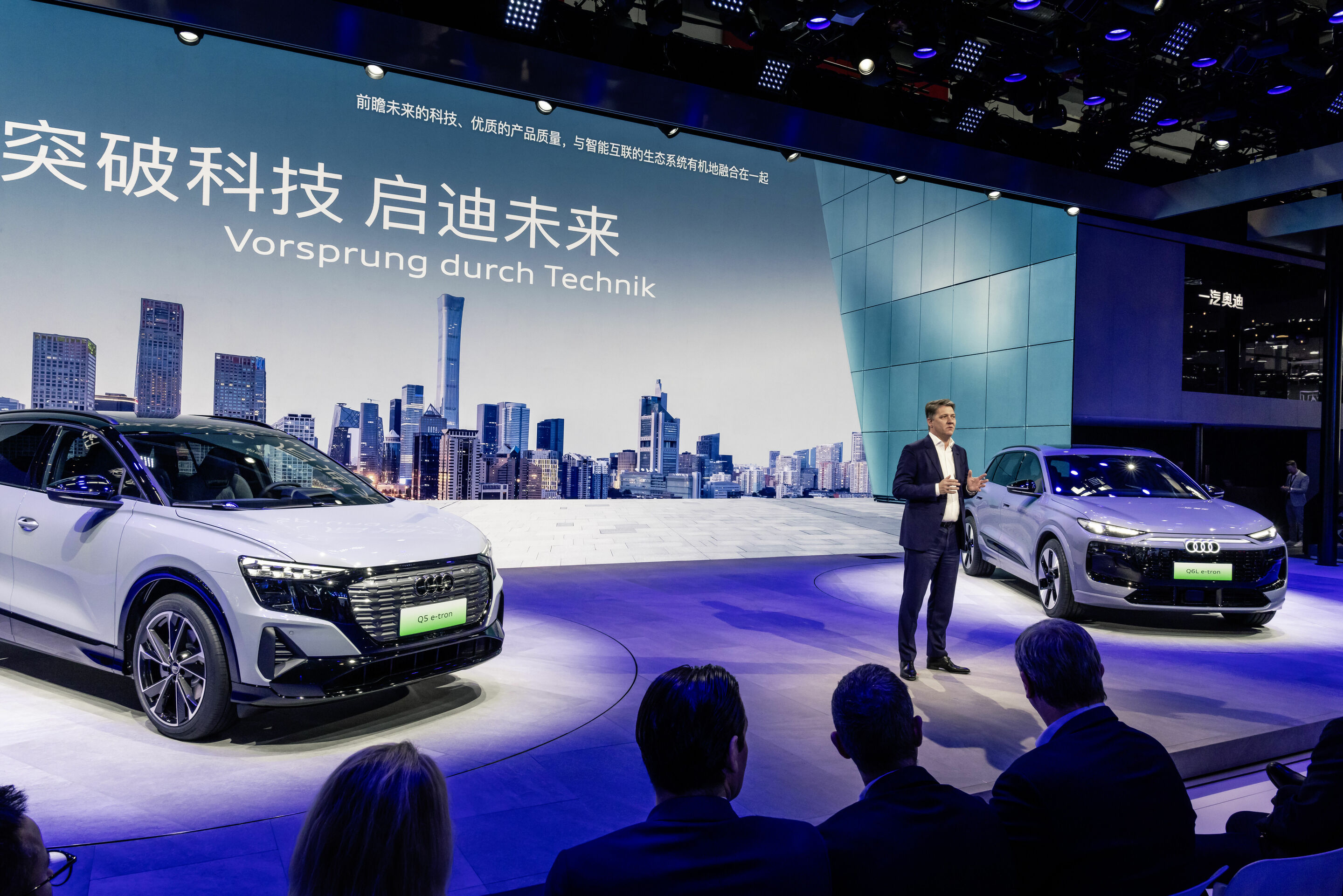 Audi at Auto China 2024 - At Auto China Audi showcases its strategy and all-electric portfolio for the world’s largest automotive market: Audi CEO Gernot Döllner with Audi Q5 e-tron RS edition and Audi Q6L e-tron