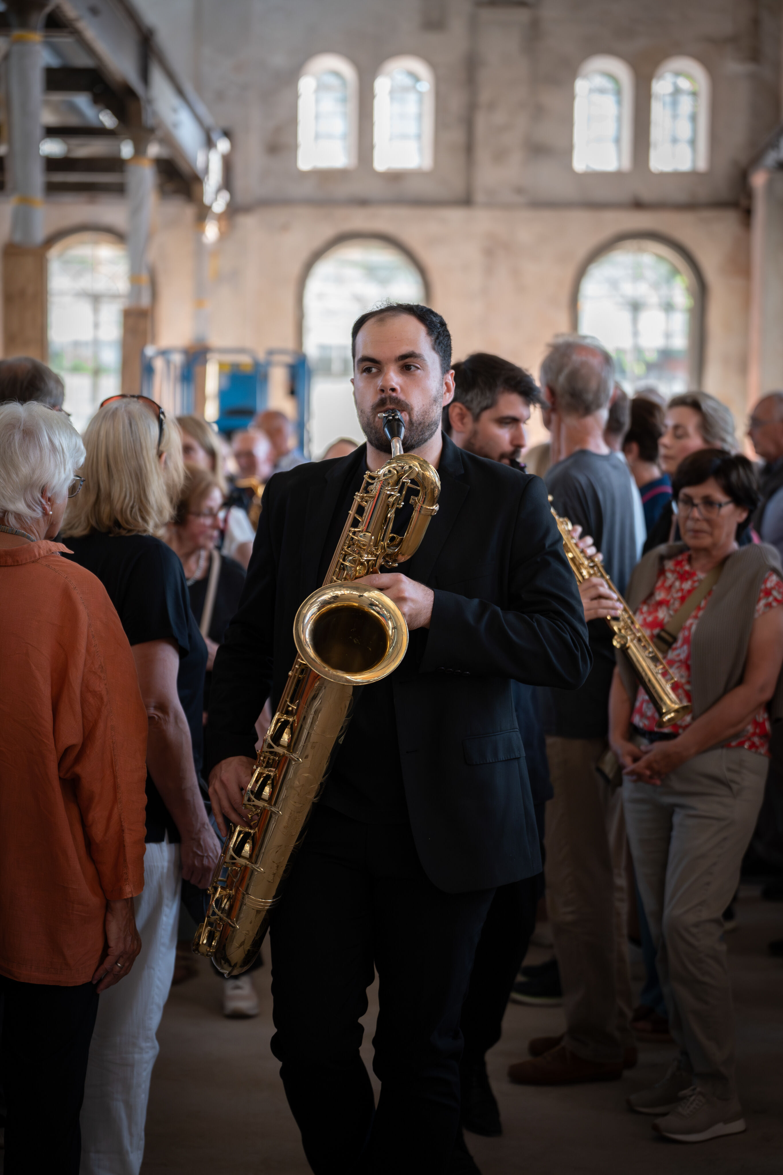 “Lux!”: Theatrical concert at the construction site of the MCAD; Arcis Saxophone Quartet, vocal ensemble LauschWerk - On the construction site of the new Museum of Concrete Art and Design Ingolstadt, Jure Knez and Claus Hierluksch from the Arcis Saxophone...