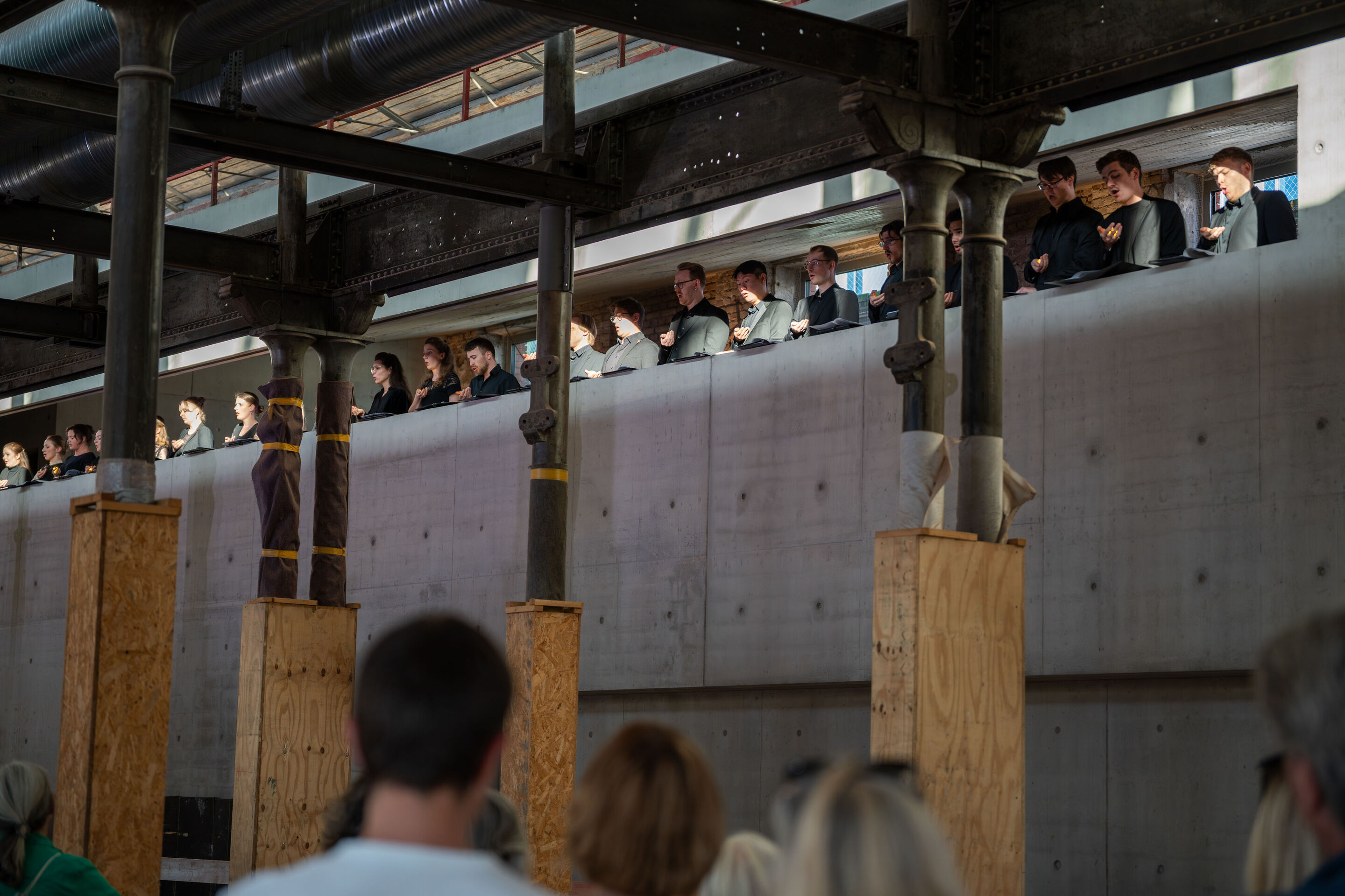 “Lux!”: Theatrical concert at the construction site of the MCAD; Arcis Saxophone Quartet, vocal ensemble LauschWerk - On the construction site of the new Museum of Concrete Art and Design Ingolstadt, the audience stands on the upper floor during the staged...