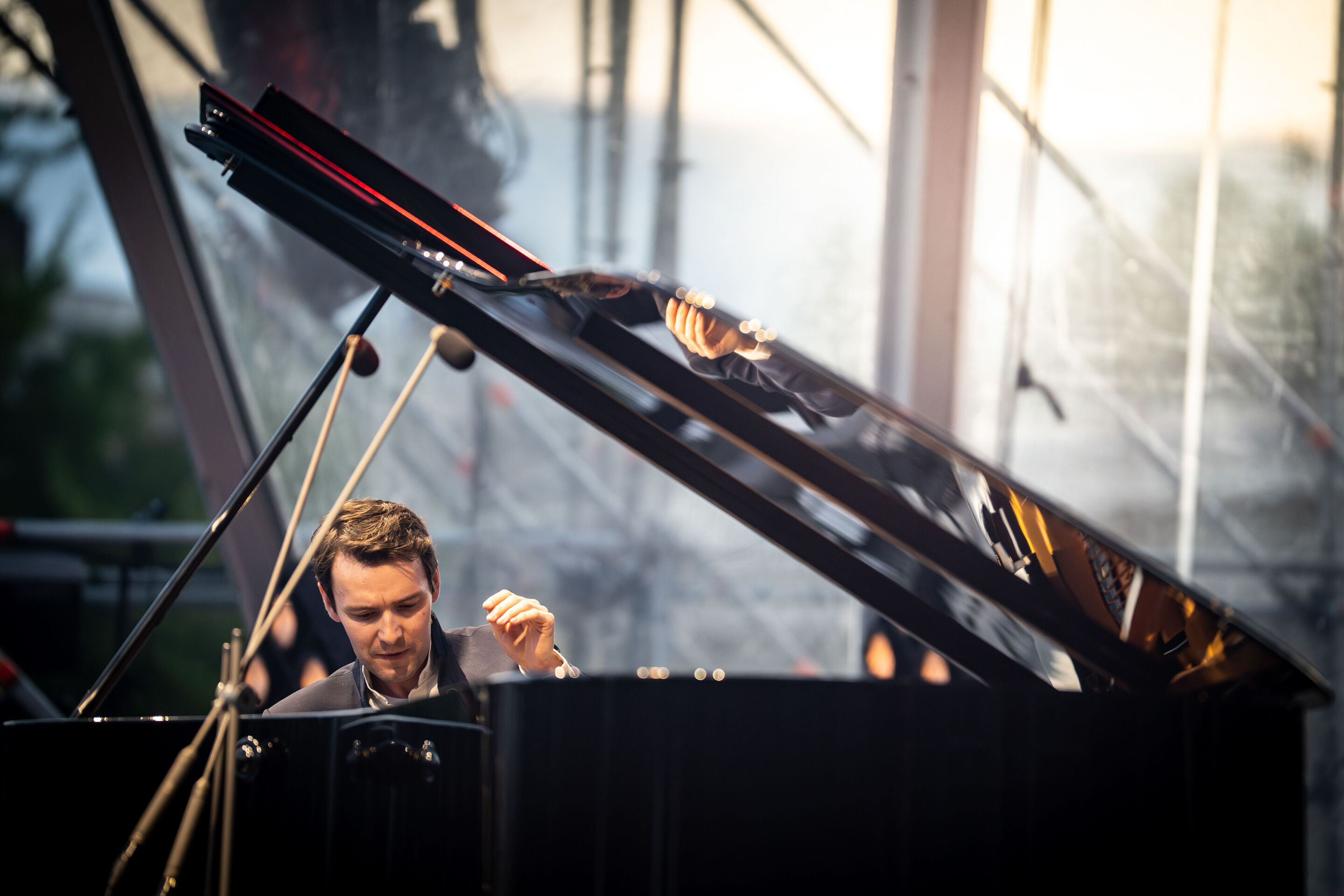 Classic Open Air – musical highlights with the Audi Philharmonic Wind Orchestra - Florian Glemser plays the piano on stage at the Classic Open Air event in Klenzepark as part of the Audi Summer Concerts.