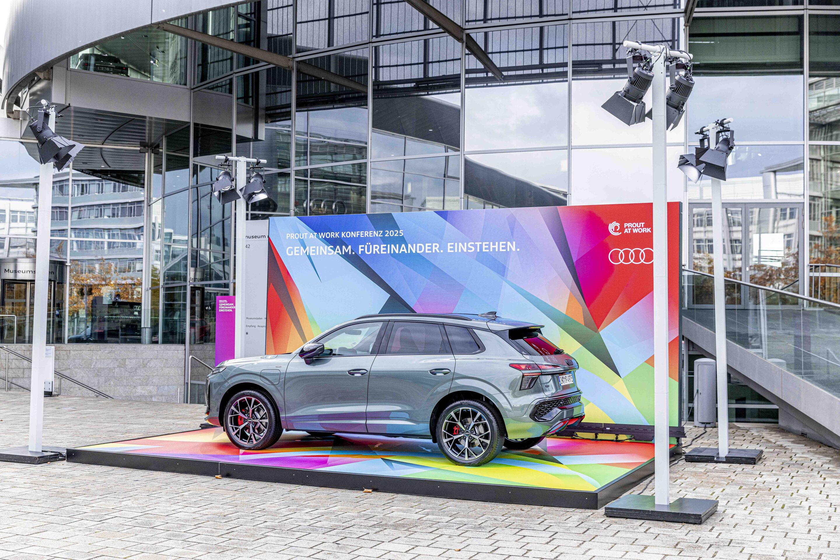 Diversity in Focus: “Prout at Work” at Audi - The new Audi Q3 on a platform in front of the museum mobile as part of the “Prout at Work” conference.