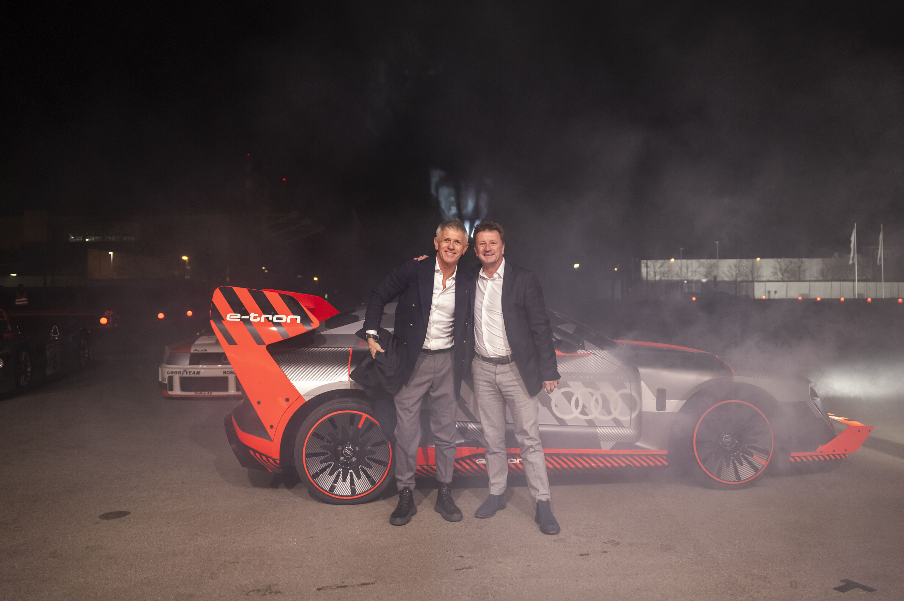 Motorsport-Legenden begrüßen den Audi R26 Concept - Audi Fahrer-Legenden sind zu Gast beim Event „Audi One“ in München, 12. November 2025: Dindo Capella (links) und Allan McNish im Audi S1 e-tron Hoonitron