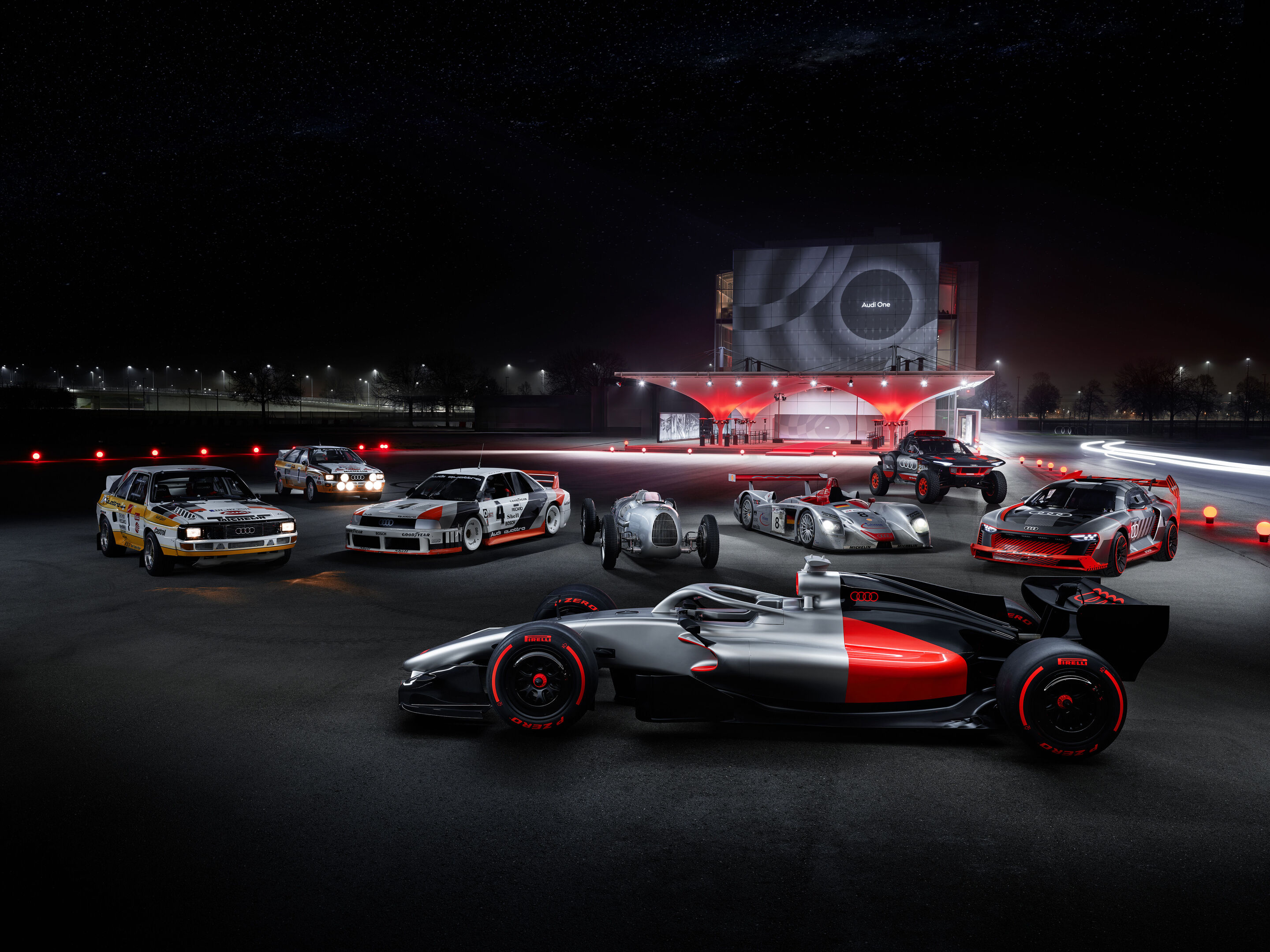 Motorsport Legenden begrüßen den Audi R26 Concept - Event „Audi One“ in München, 12. November 2025. Im Bild (v. l. n. r): Audi Sport quattro Rallye S1, Audi quattro Rallye A2, Audi 90 quattro IMSA GTO, Audi R26 Concept, Auto Union Typ C, Audi R8 LMP,...