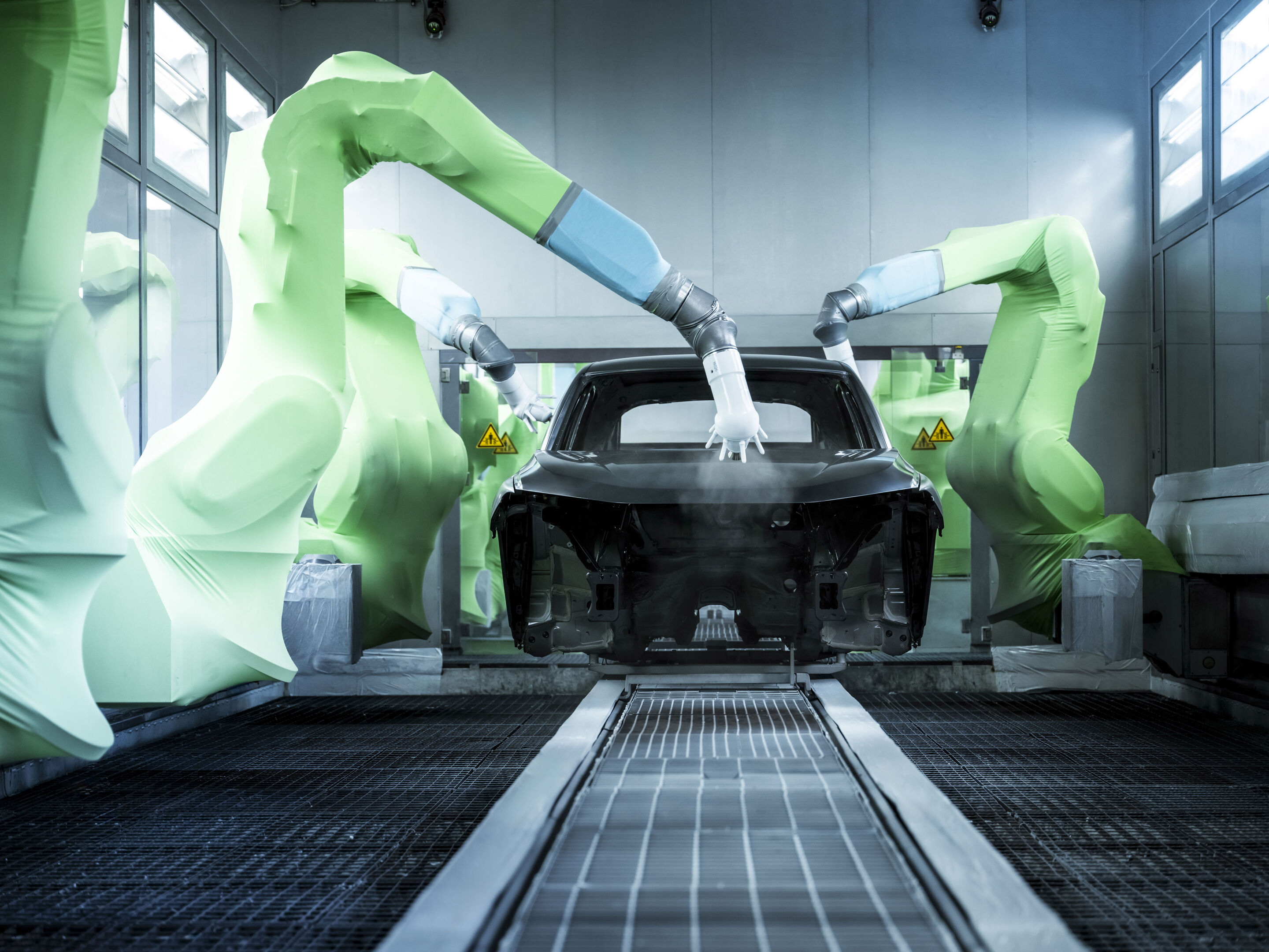 Audi Q5 production at San José Chiapa site - Robots apply paint to a car body