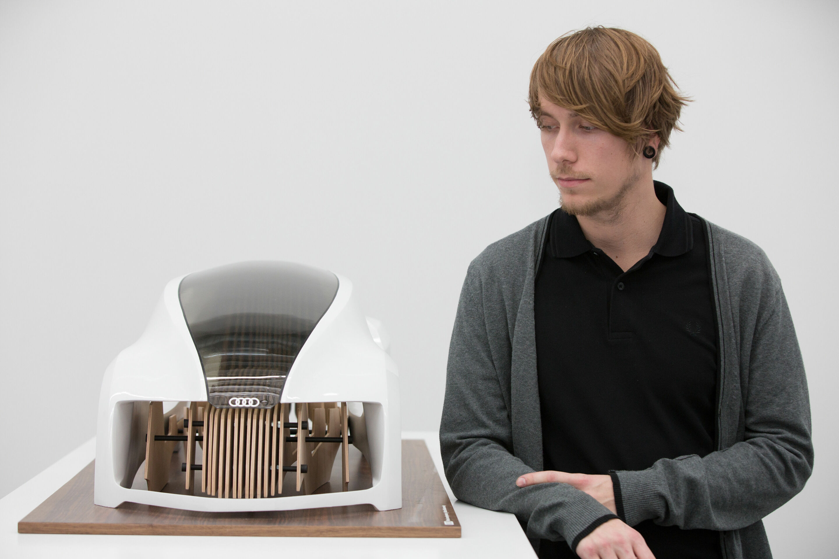 Audi Hosts Design Universities - Design student Adrian Mankovecký from the Academy of Fine Arts and Design in Bratislava with his “Wood Aerodynamics” concept for the academy’s cooperative project with Audi.