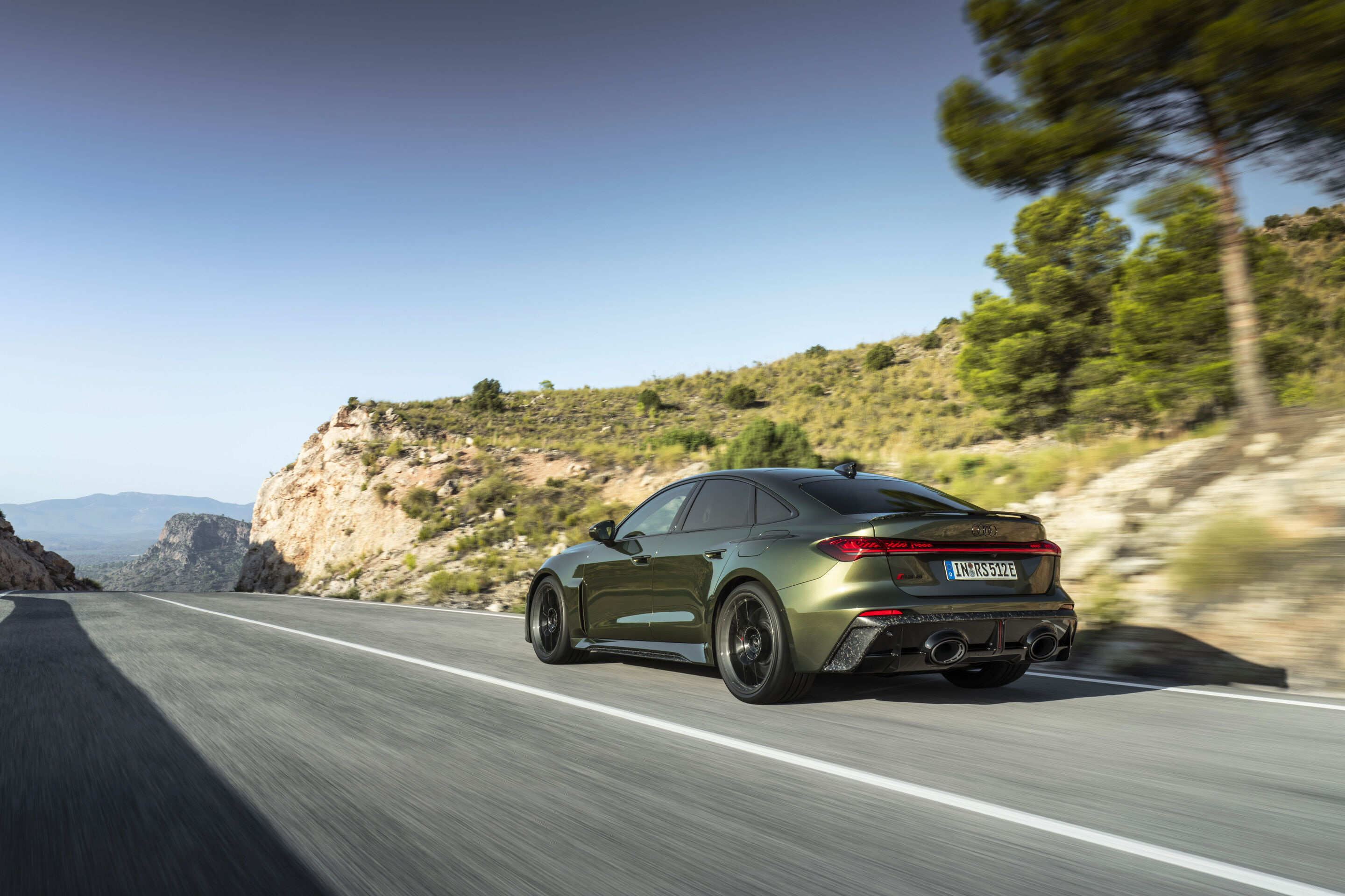 Audi RS 5 Sedan - Bedford green metallic, outdoor dynamic photo, exterior, three-quarter rear view