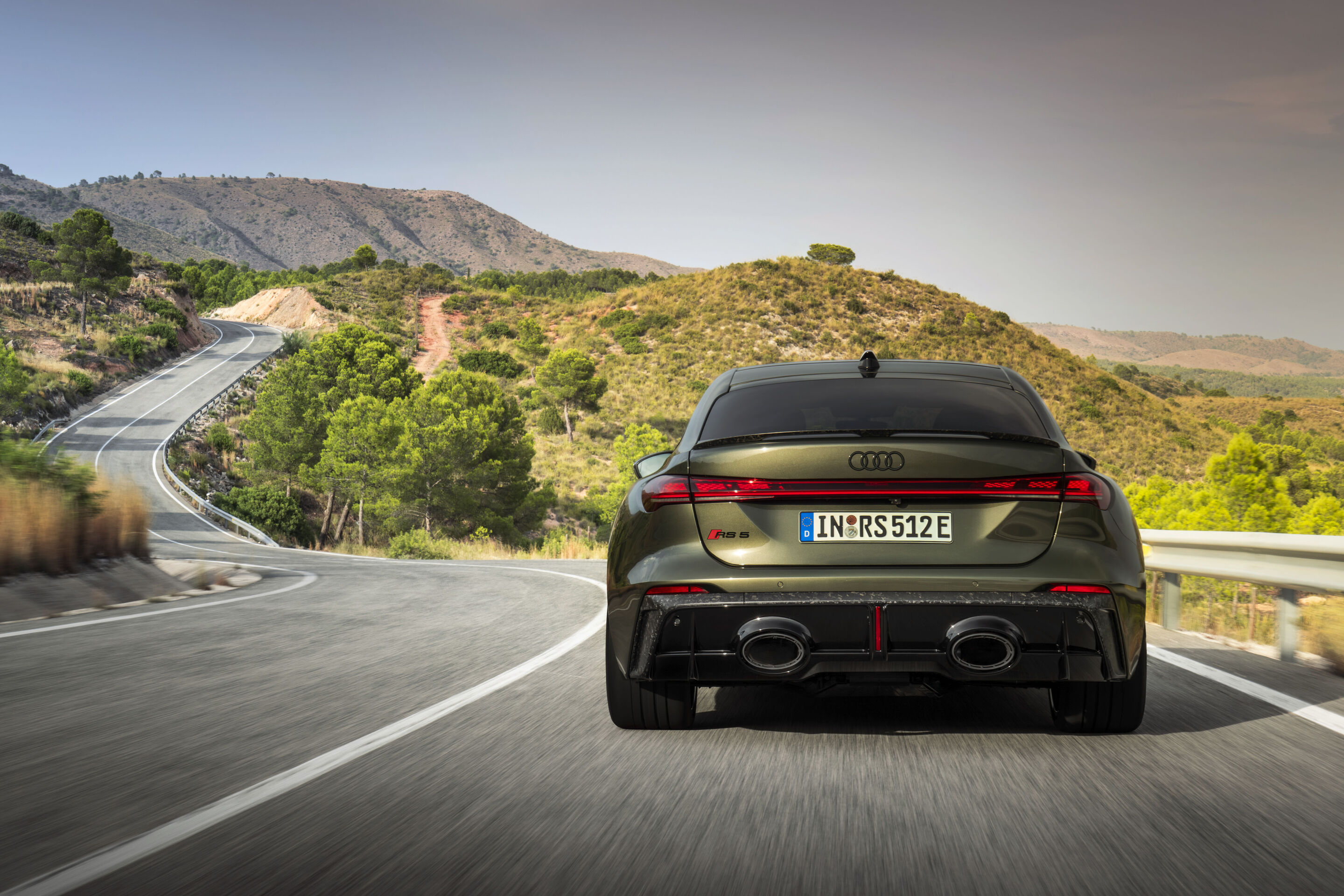 Audi RS 5 Sedan - Bedford green metallic, outdoor dynamic photo, exterior, rear view