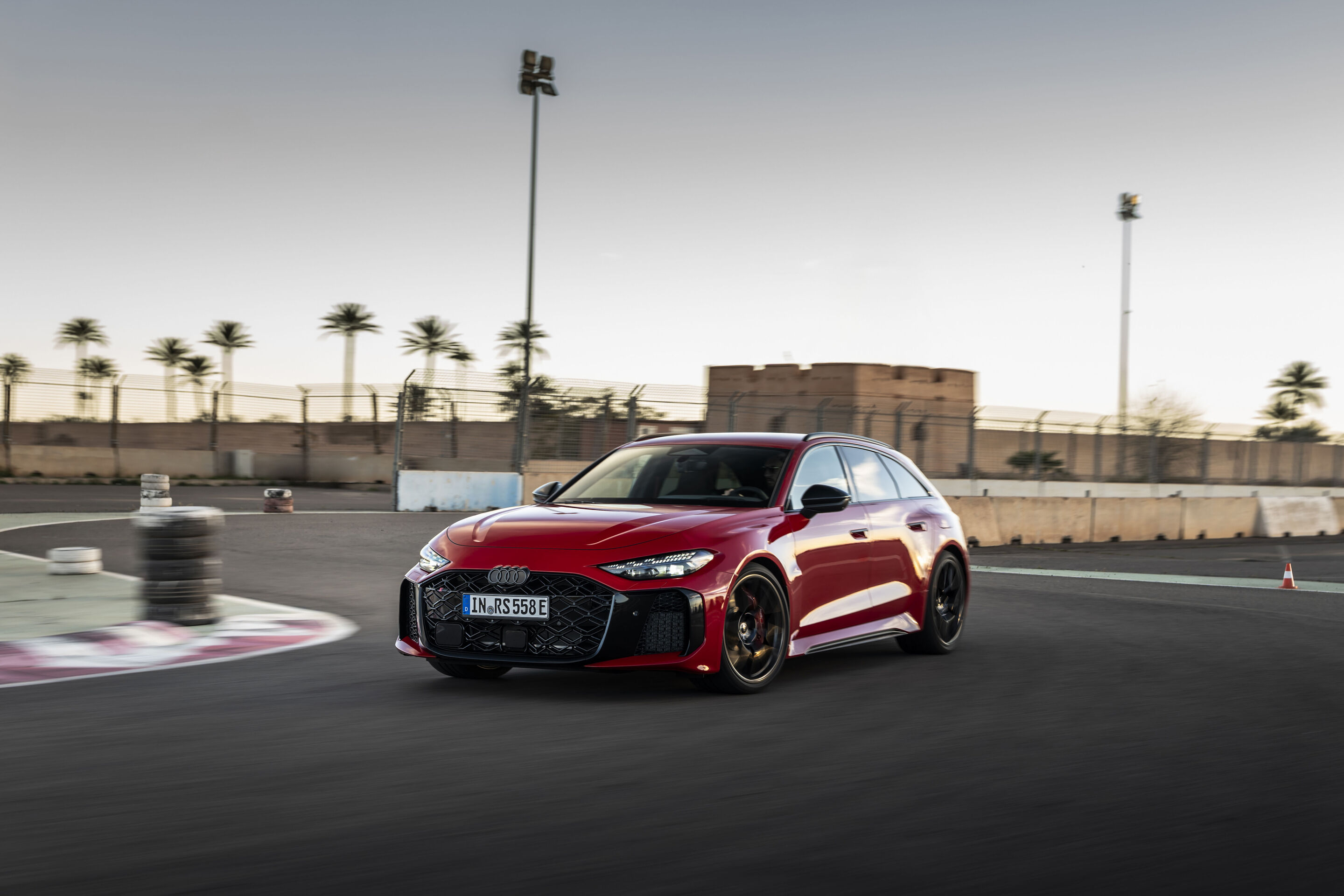 Audi RS 5 Avant - The Audi RS 5 Avant in Progressiv red in a fast corner at the Circuit de Marrakech: maximum agility enabled by quattro drive.