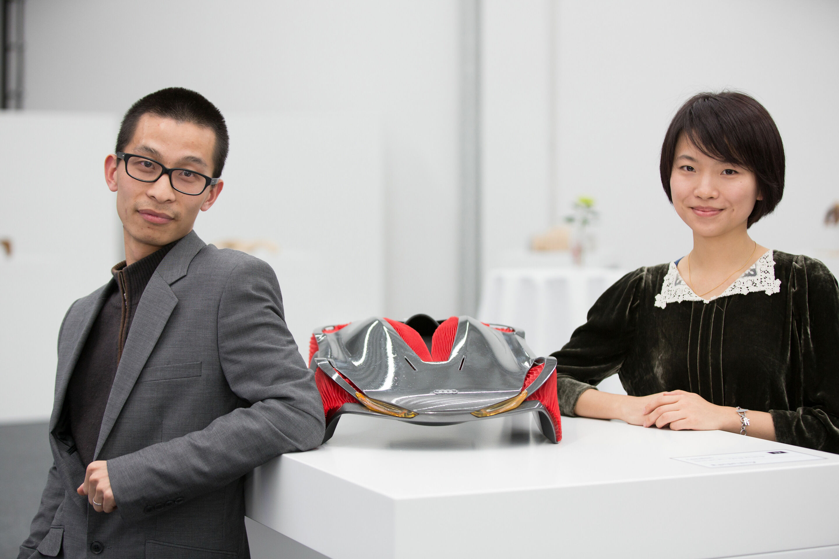 Audi Hosts Design Universities - Students Shihan Pi and Yjing Zhang from the Royal College of Art in London with their “Epiphany” concept for the college’s cooperative project with Audi. The project combines textile design with car design.