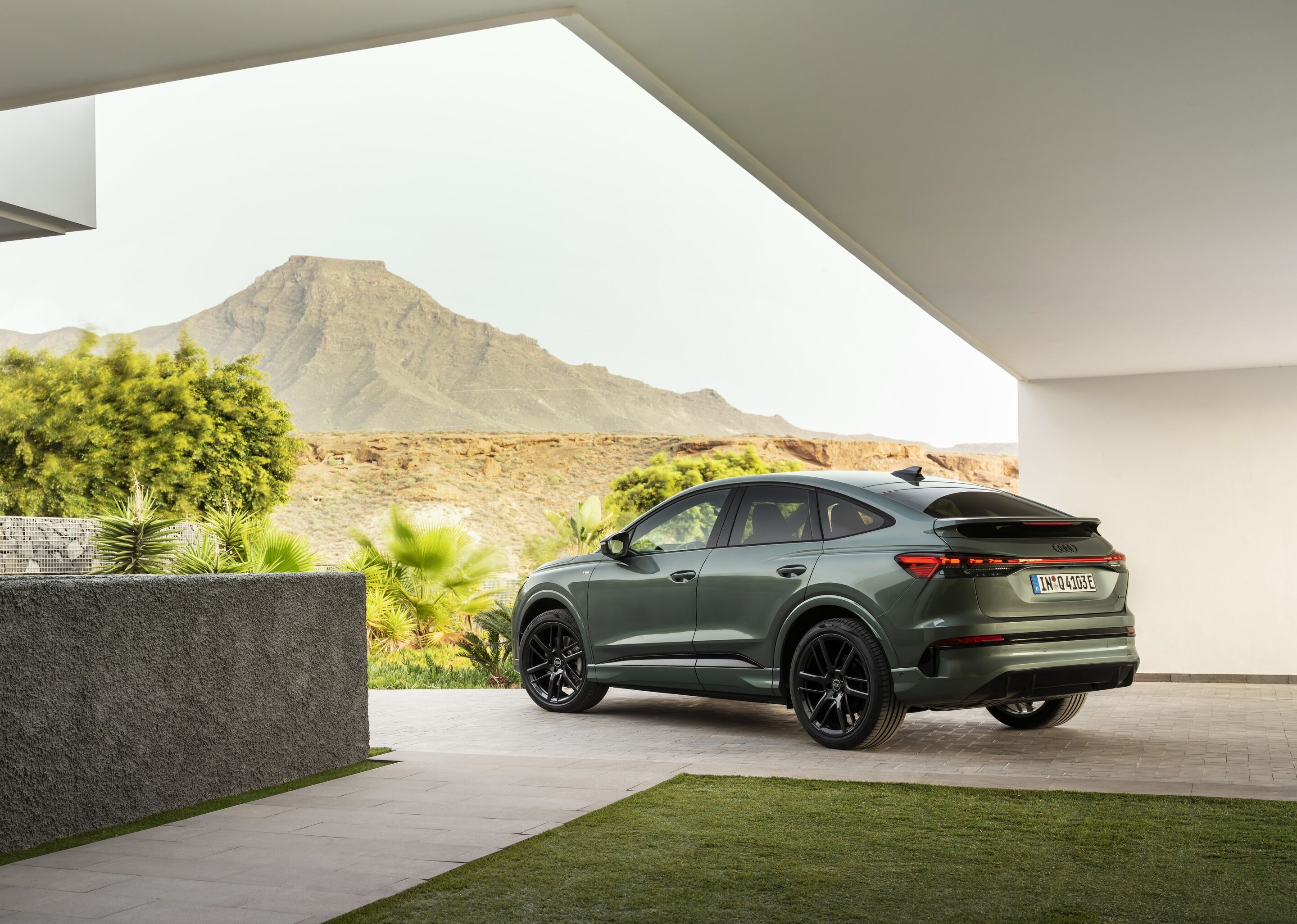 Audi Q4 Sportback e-tron - Sage green metallic, outdoor static photo, exterior, three-quarter rear view