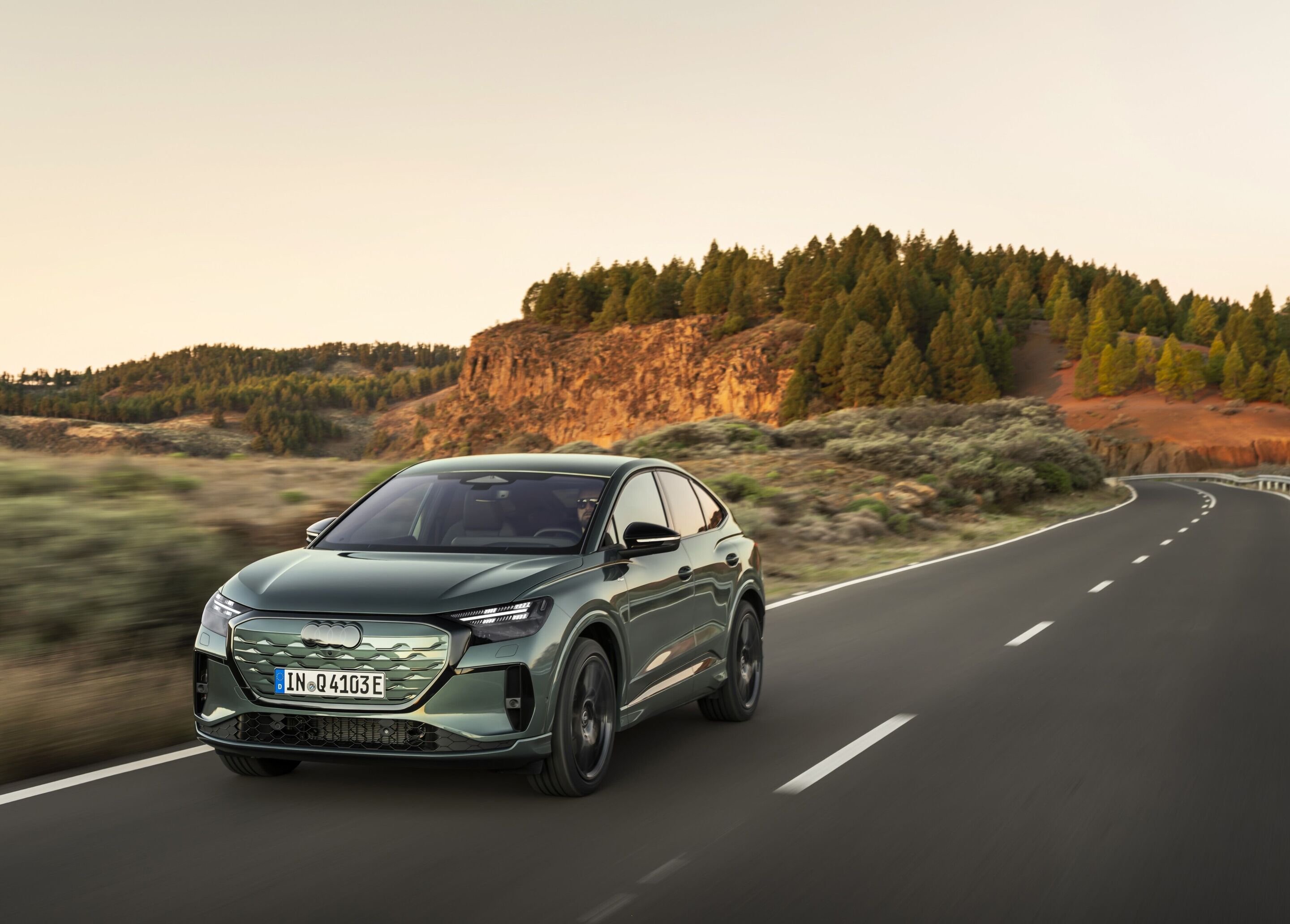 Audi Q4 Sportback e-tron - Sage green metallic, outdoor dynamic photo, exterior, three-quarter front view