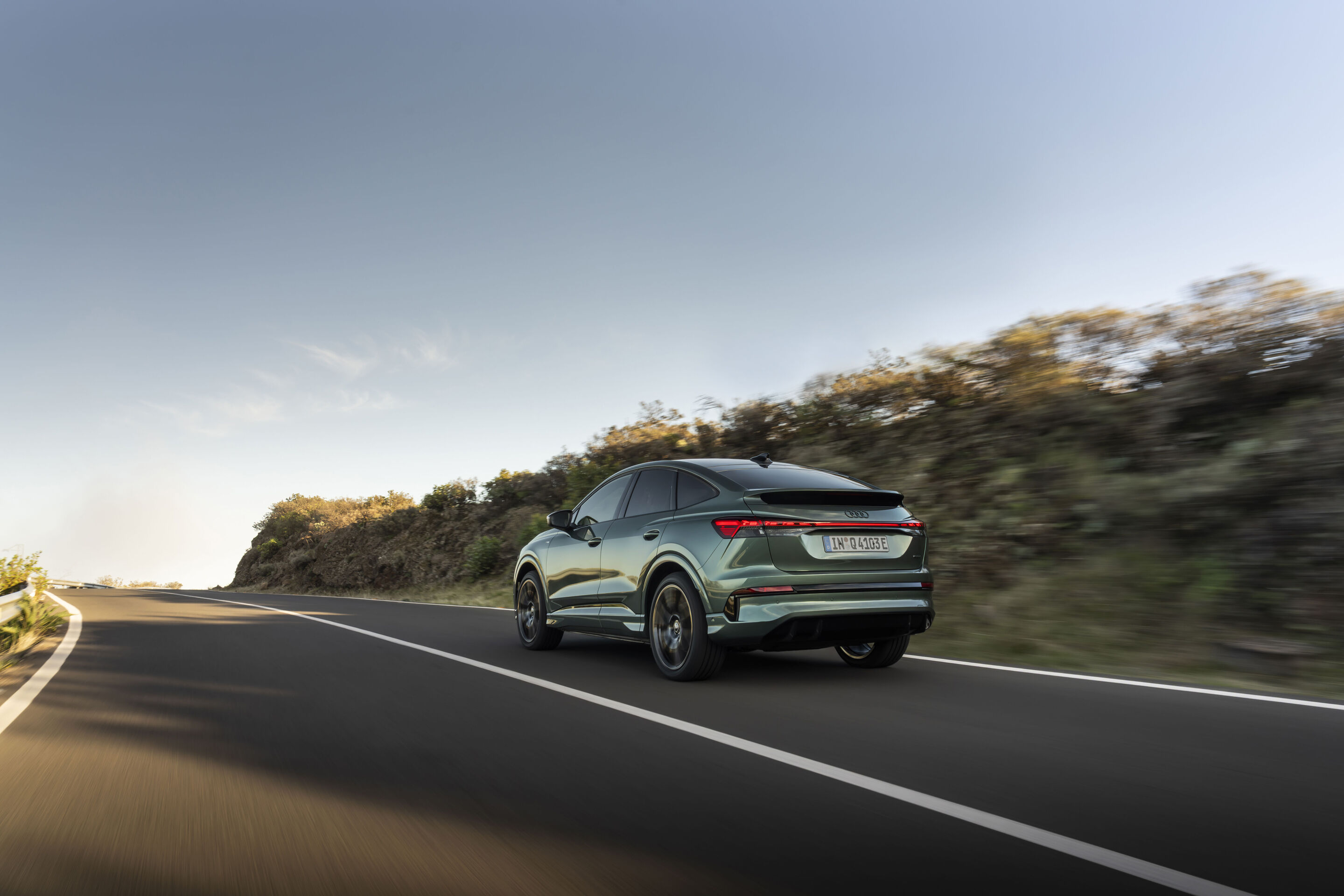 Audi Q4 Sportback e-tron - Sage green metallic, outdoor dynamic photo, exterior, three-quarter rear view