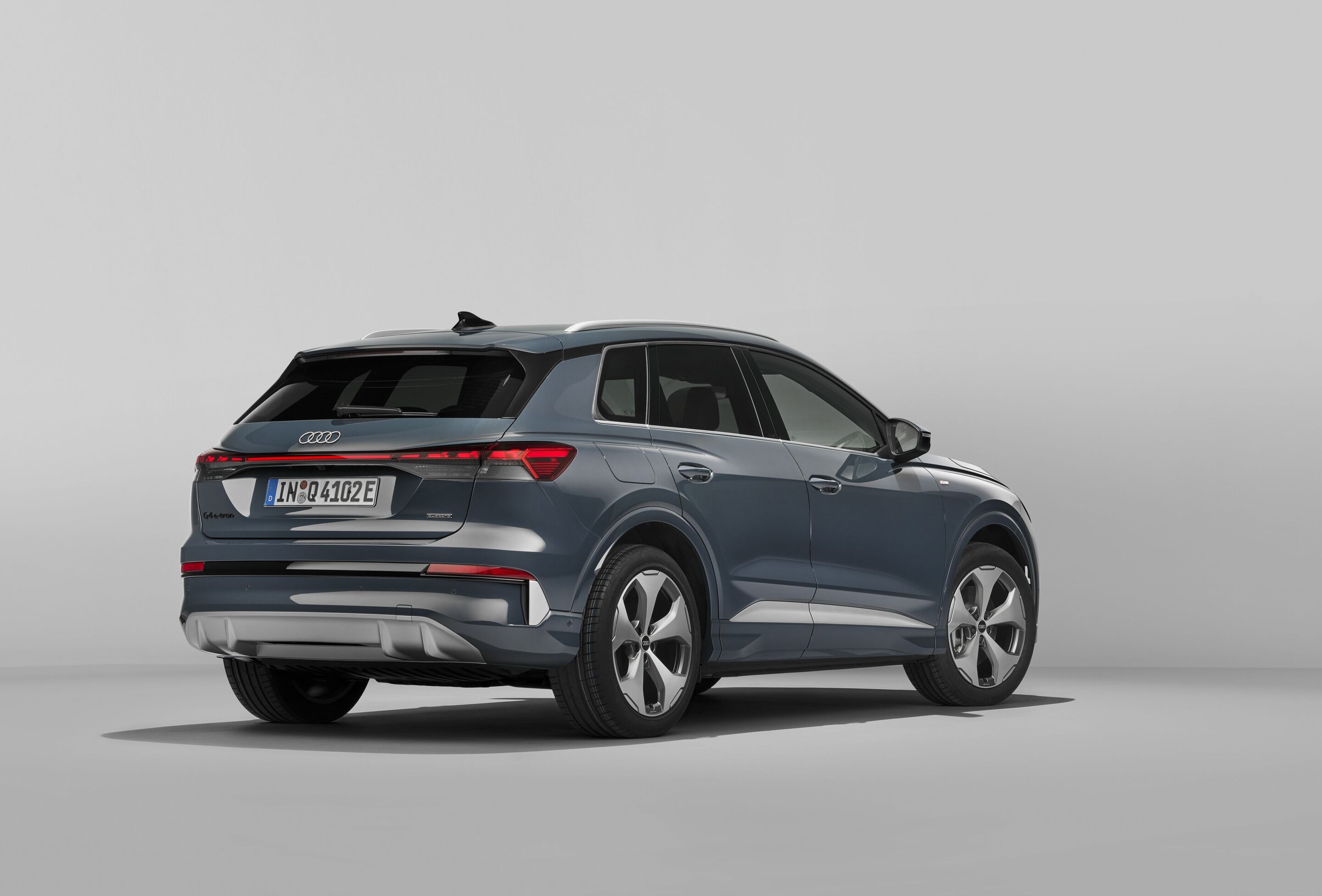 Audi Q4 SUV e-tron - Plasma blue, studio static photo, exterior, three-quarter rear view