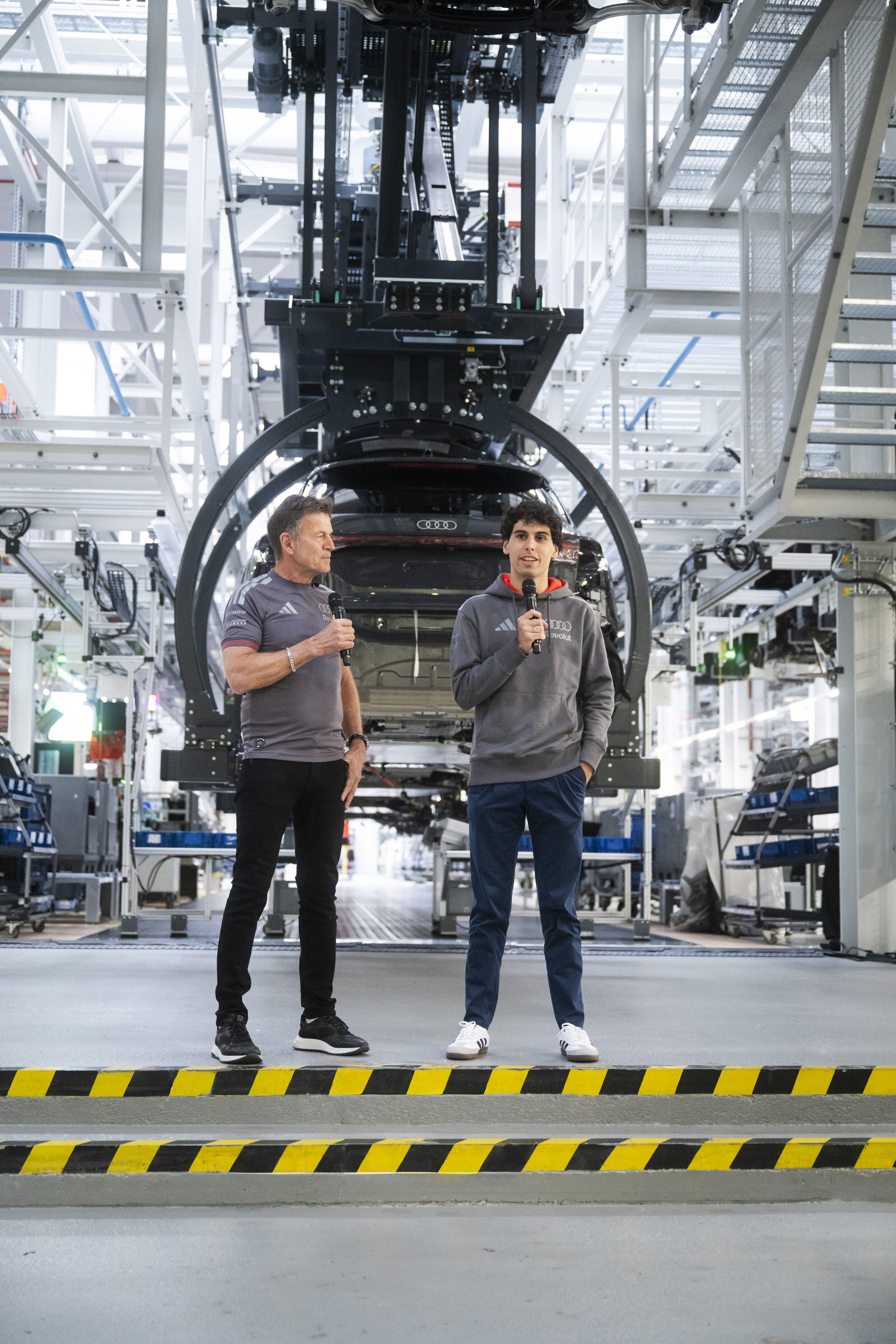 Audi F1 driver Gabriel Bortoleto visits Ingolstadt - Wolfgang Rother in conversation with Gabriel Bortoleto, driver for the Audi Revolut F1 Team, at the Audi production facility in Ingolstadt