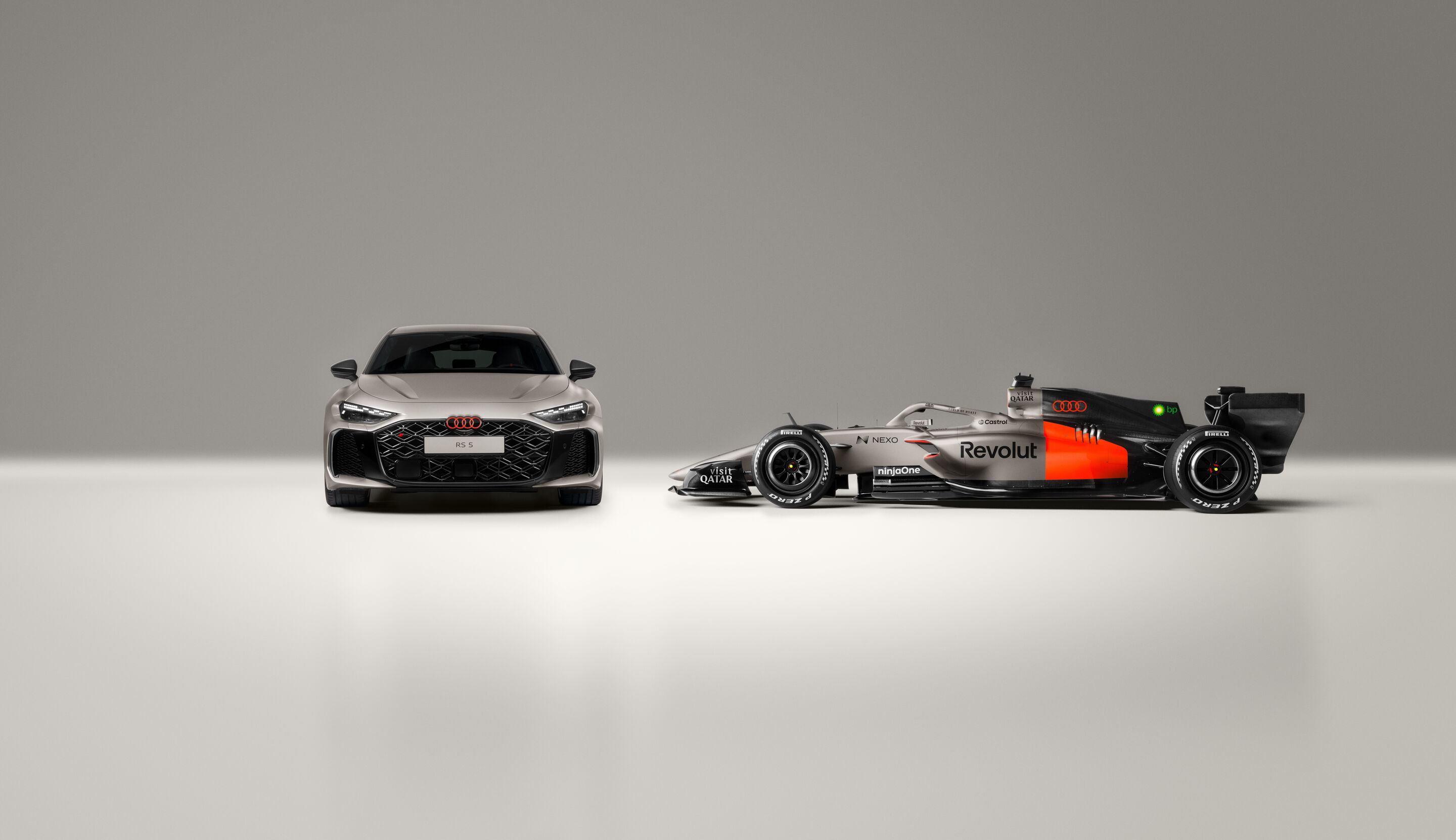 Audi RS 5: Debut as hot-lap car at Formula 1 - The Audi RS 5 next to the Audi R26. The RS 5 makes its debut at the Formula 1 Miami Grand Prix as a car for the F1® Pirelli Hot Laps