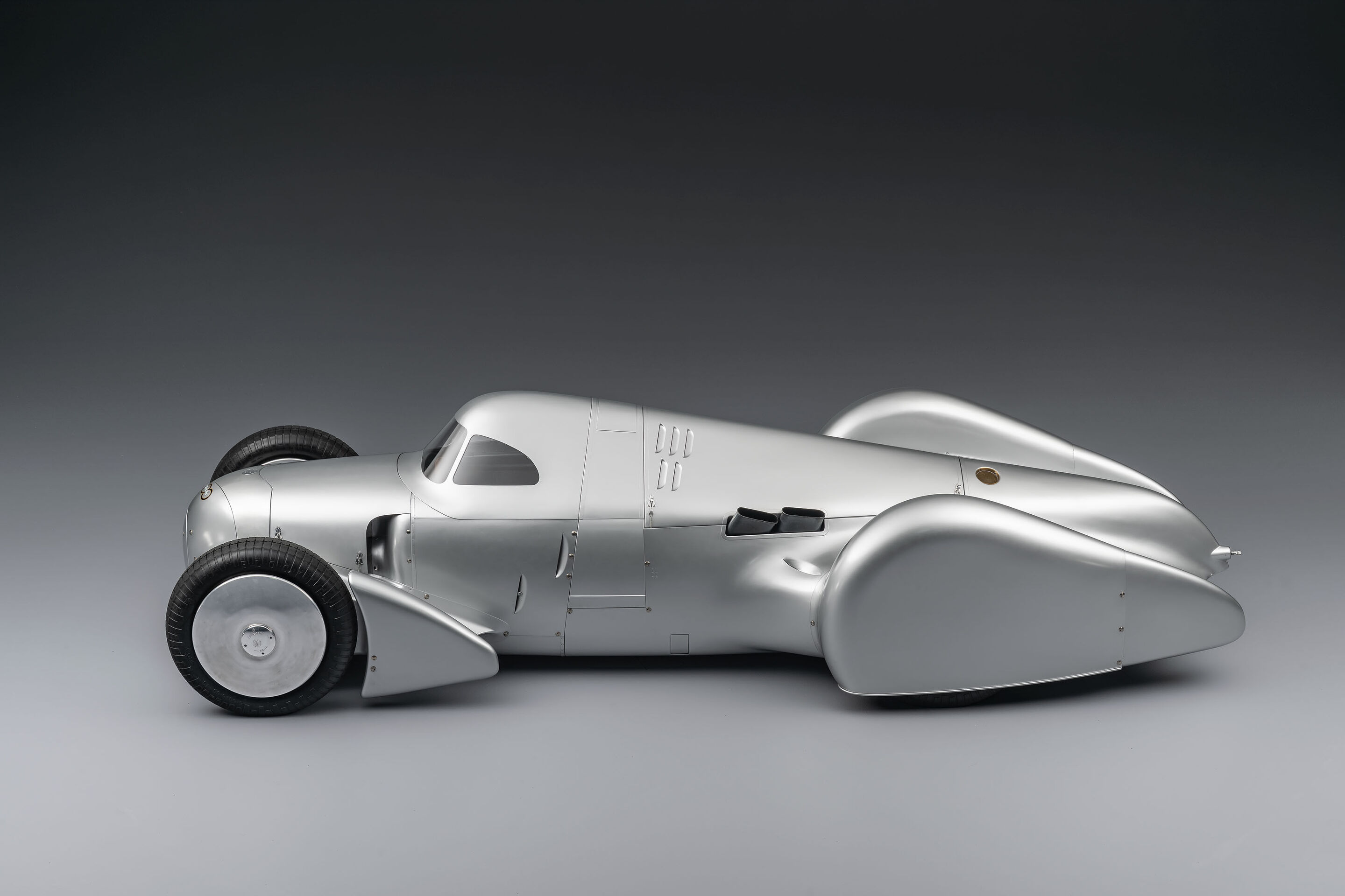 Auto Union Lucca - Audi recreated the Auto Union Lucca. After just over three years of construction, the record-breaking car was completed in early 2026. Studio shot. Side view.