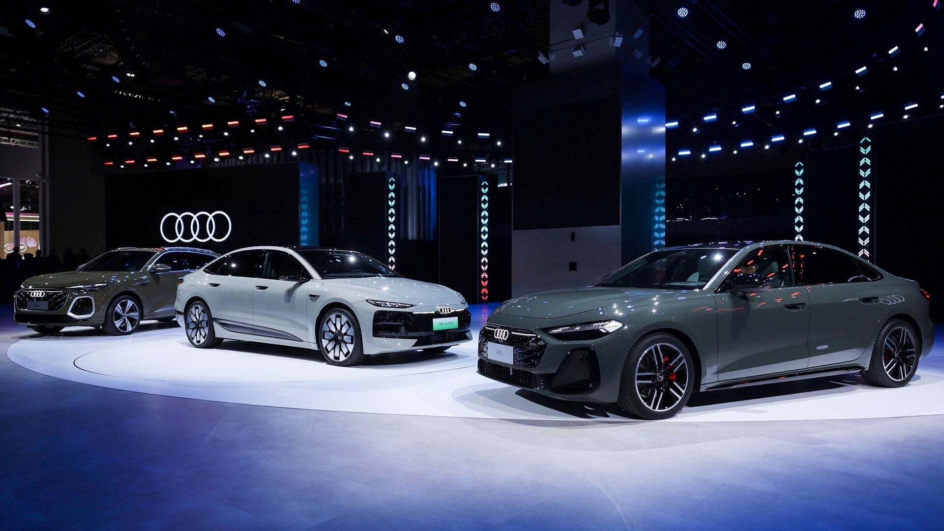 Audi Q5L, Audi A6L e-tron and an A5L on the 2025 Auto Shanghai stand