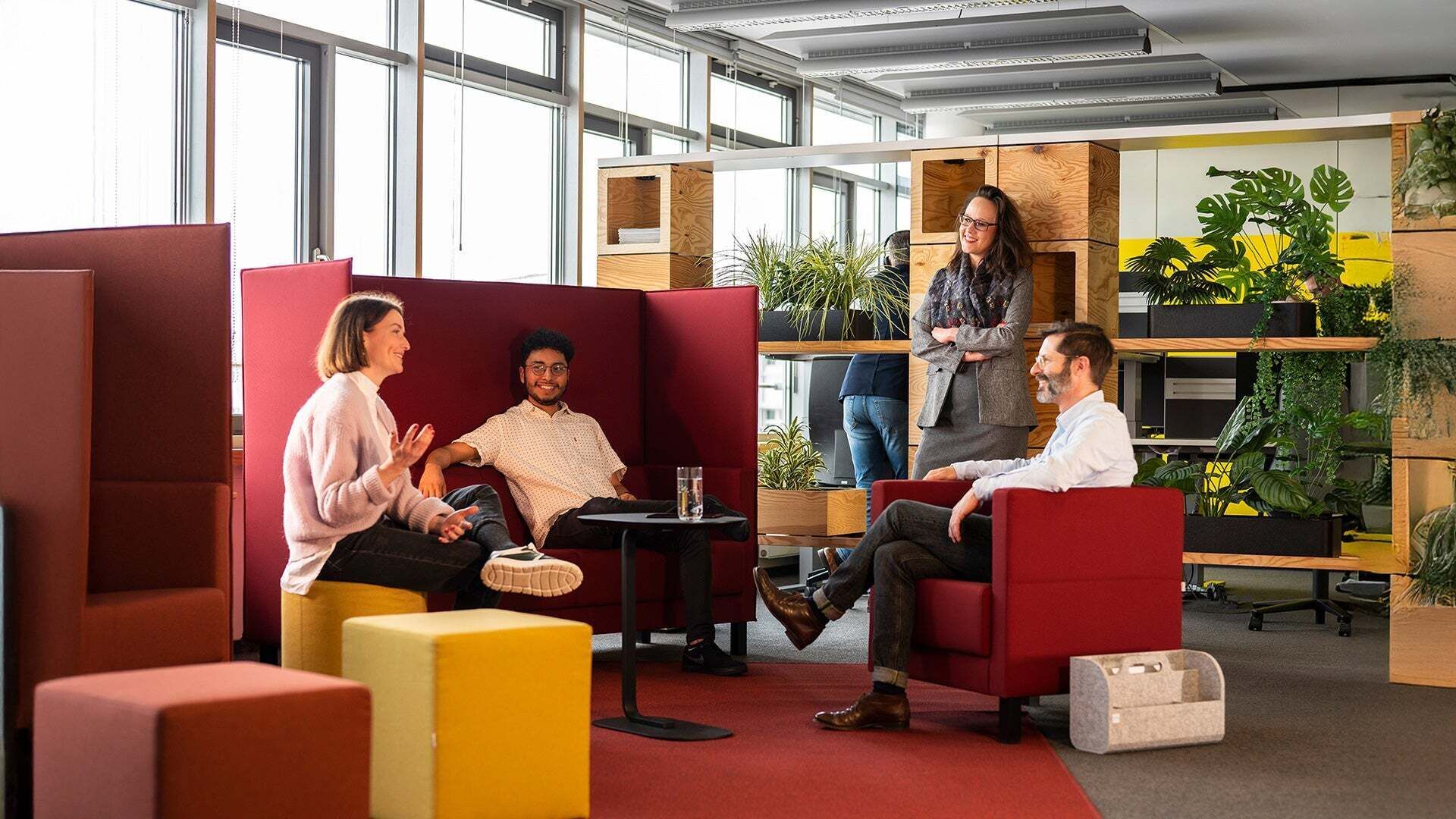 A group of people chatting in a seating area