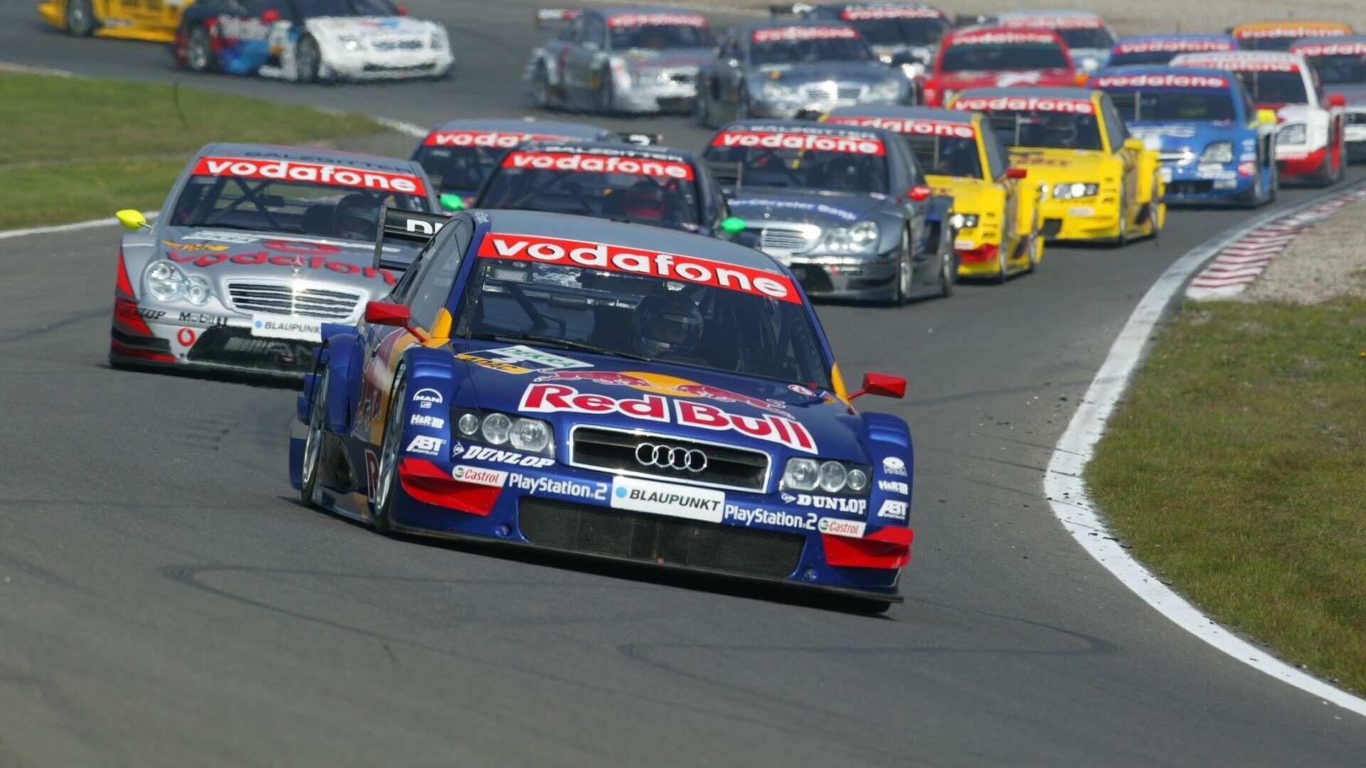 A picture showing Mattias Ekström’s Audi A4 DTM leading the race at Zandvoort in 2004.