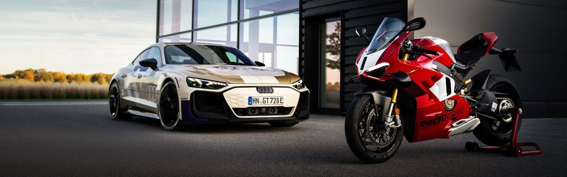 Audi e-tron GT quattro standing next to Ducati Panigale V4 R