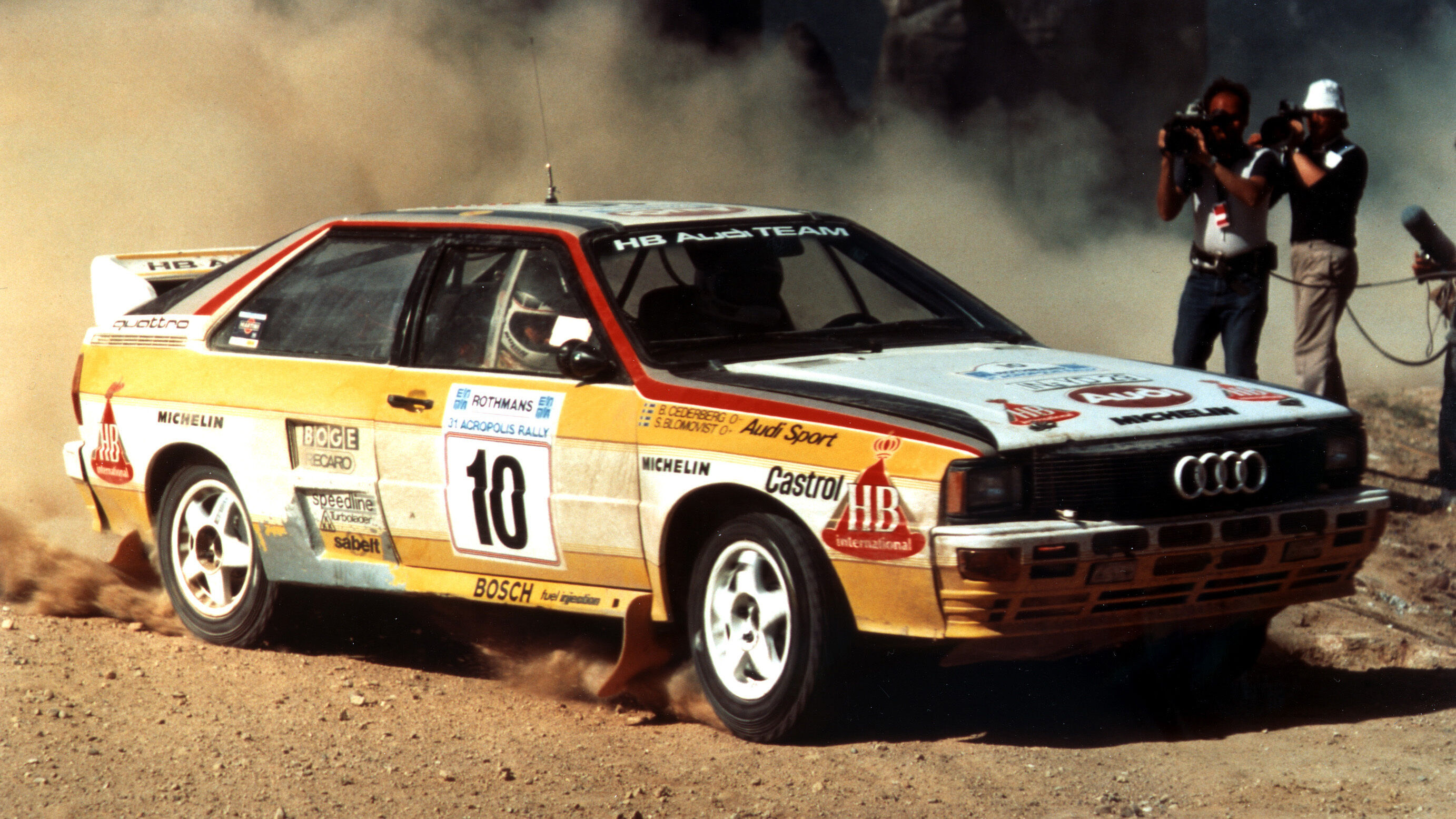 A picture showing an Audi quattro A2 rally car on gravel in Greece in 1984.