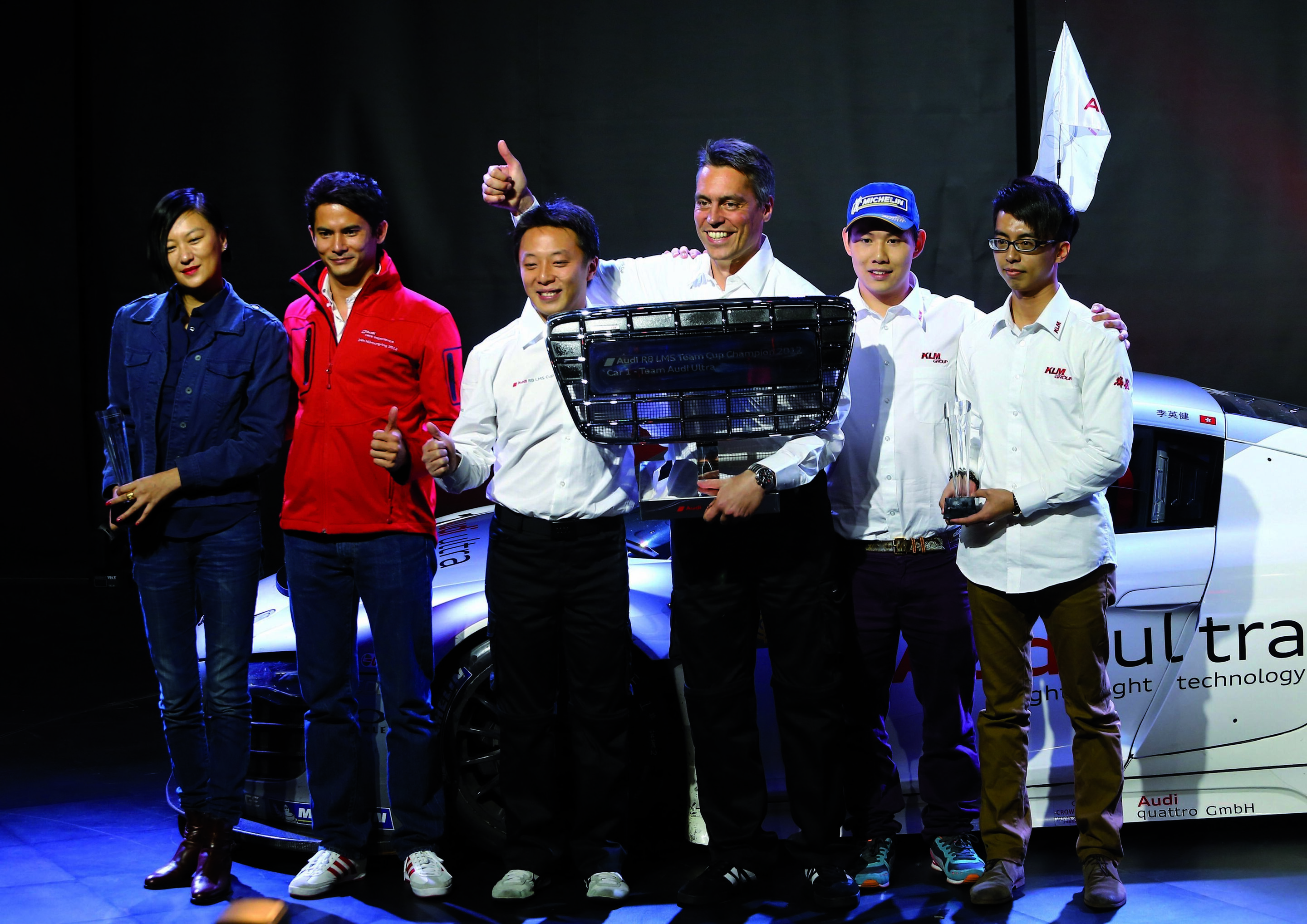 Marchy Lee triumphs in Audi R8 LMS Cup - At Shanghai, Marchy Lee (third from left) celebrated the title win in the Audi R8 LMS Cup. In the presence of former Olympic epee fencing gold medalist Britta Heidemann the Audi driver from Hong Kong only needed...