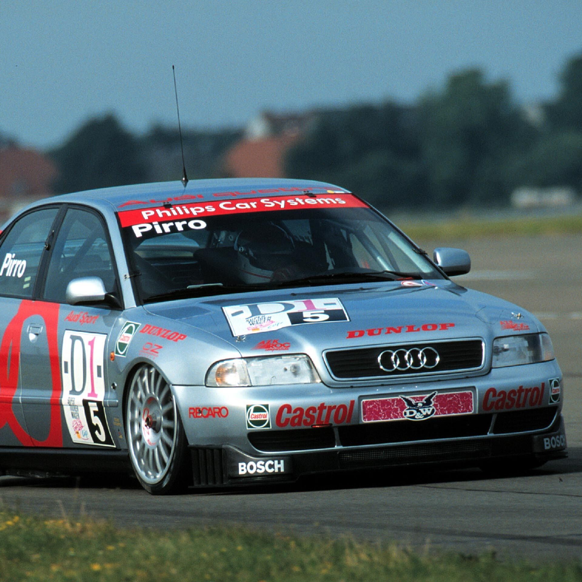 A picture showing an Audi A4 quattro race car on track in Germany in 1996.