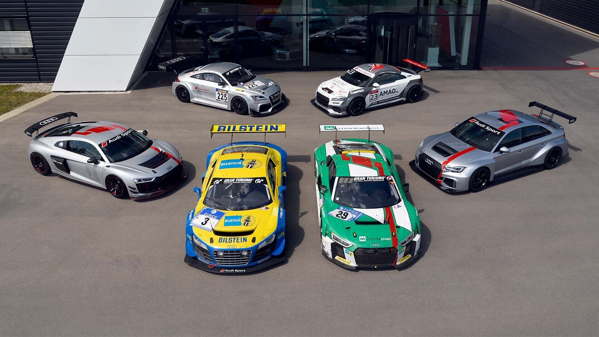 A picture showing a collection of six race cars from the history of Audi Sport customer racing.