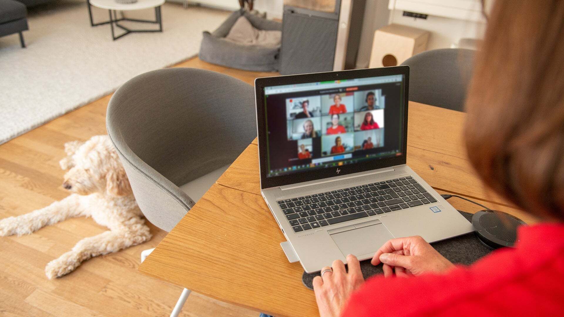 A woman is sitting at a table and having a meeting.