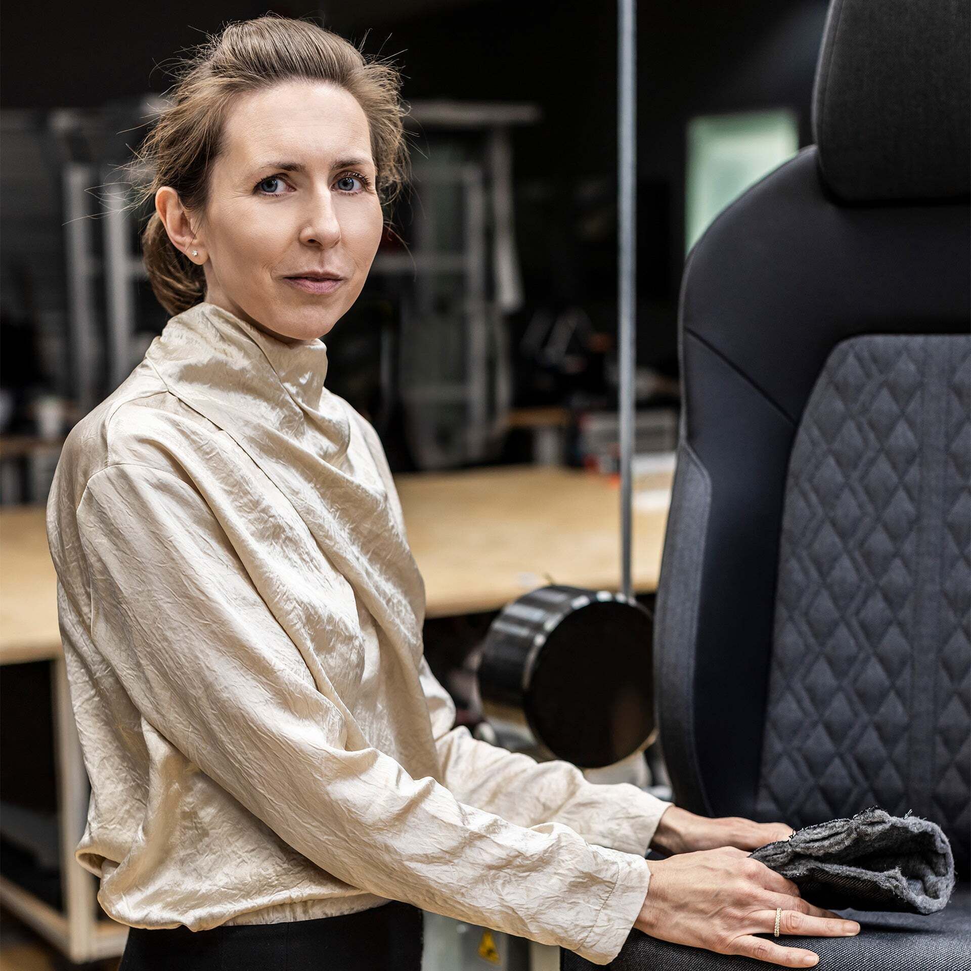 Christine Maier next to a car seat - Christine Maier next to a car seat