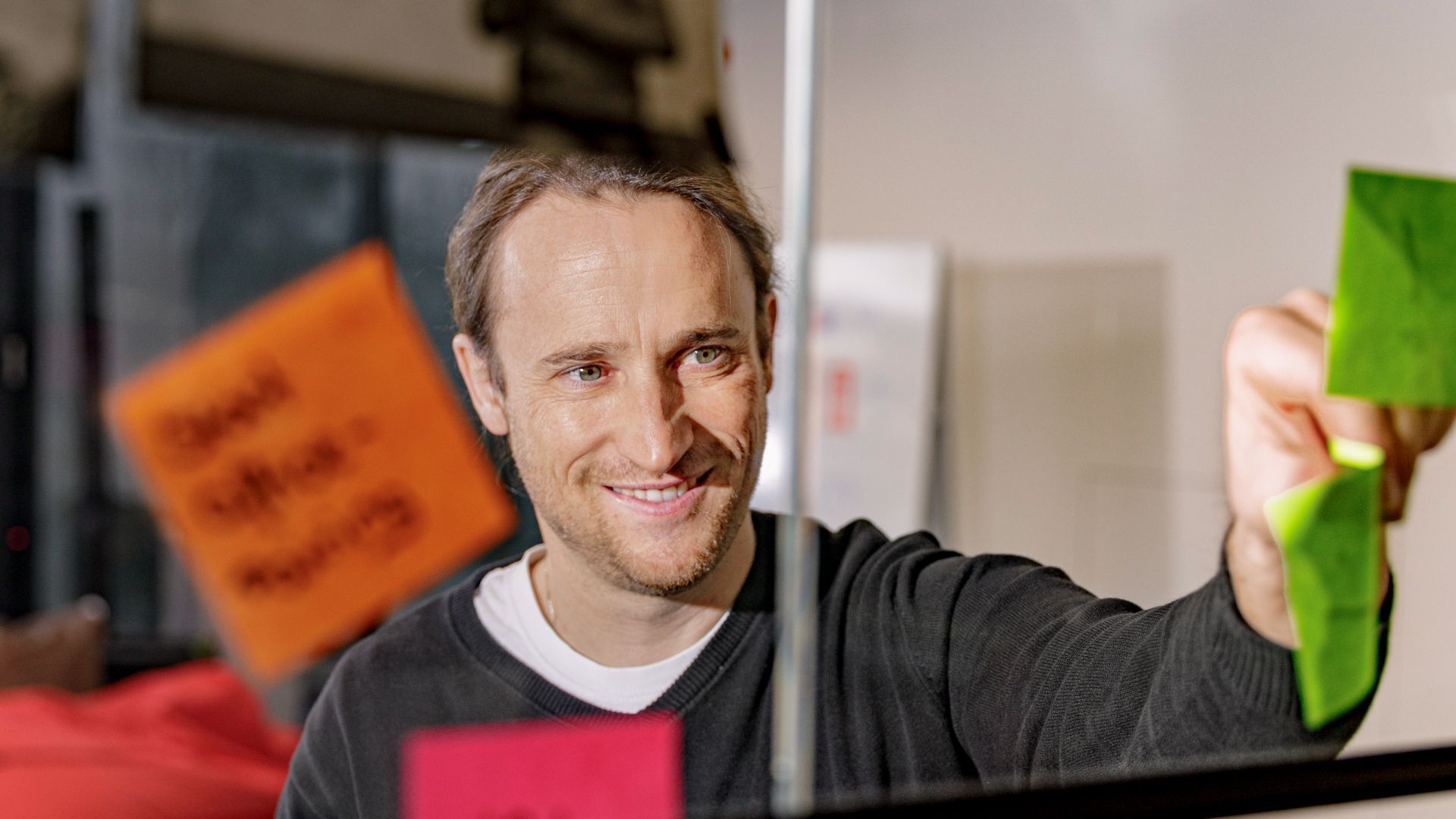 Michael Hügel smiles past the camera