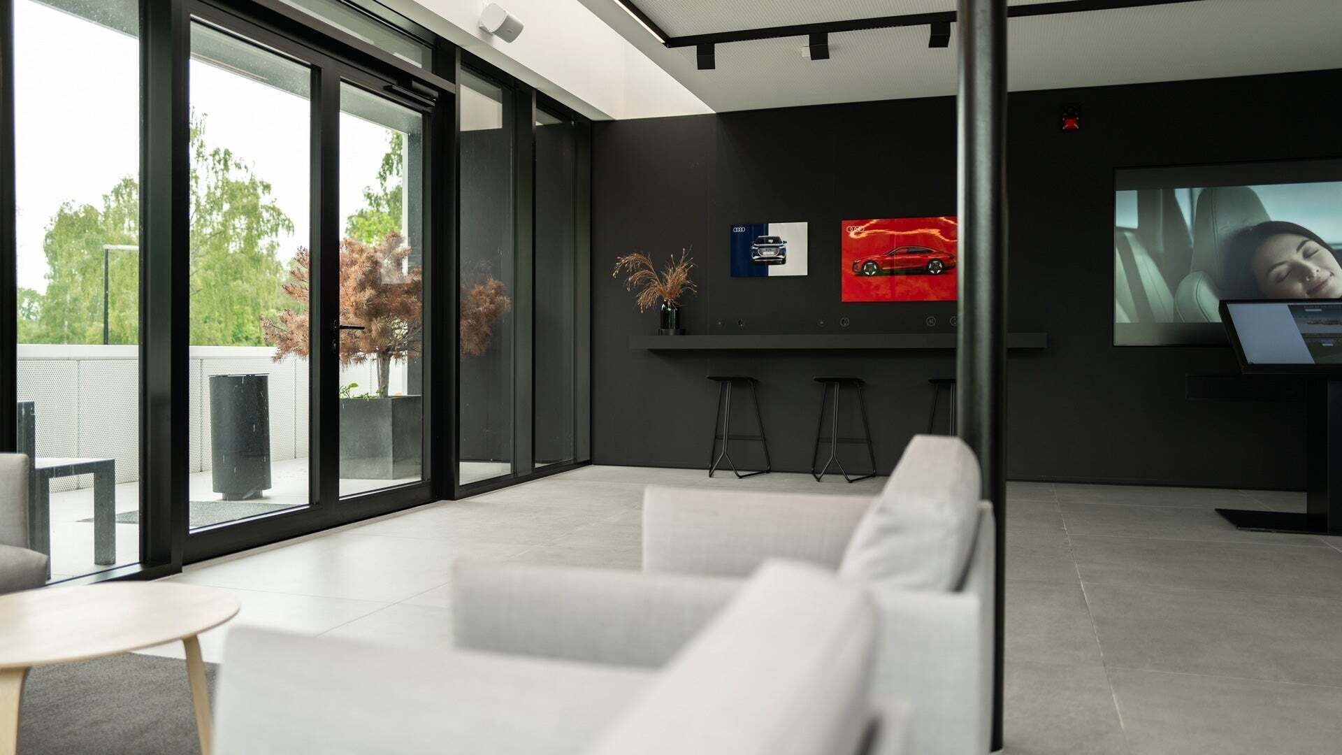 The interior view of the Audi charging hub with lounge furniture