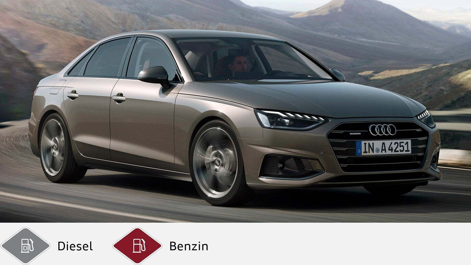 Brauner Audi A4 Limousine in Kurvenfahrt auf Bergstraße, Fahrer erkennbar. Unten graues Dieselsymbol und rotes Benzinsymbol.