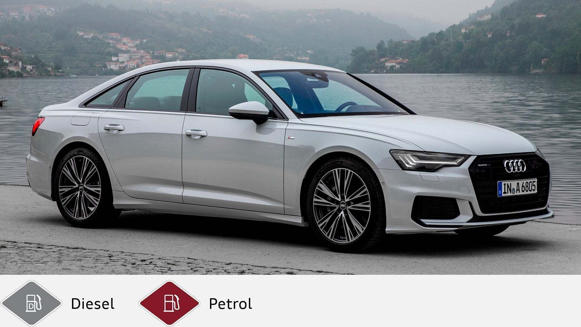 Silver Audi A6 Sedan (from 2018) in front of lakeshore with houses in the background. Gray diesel symbol and red petrol symbol at the bottom.