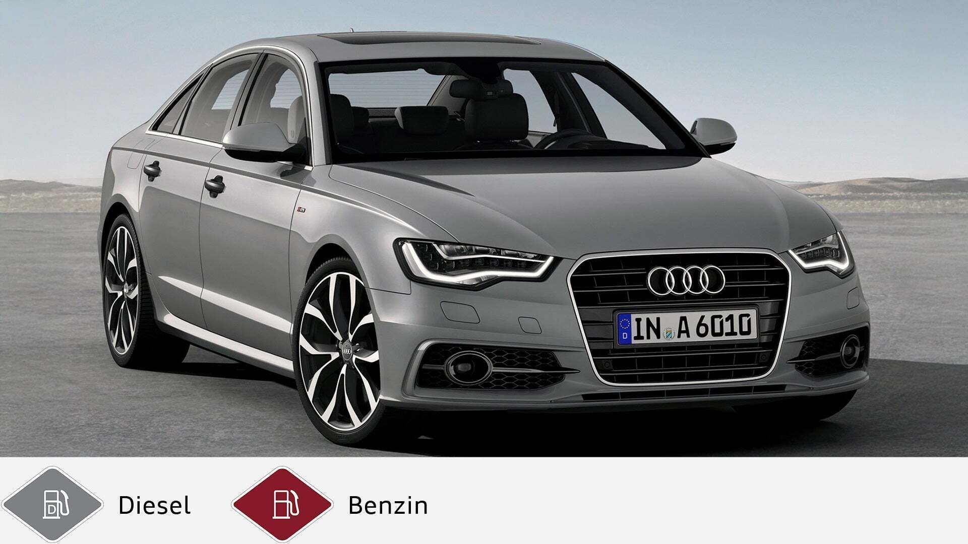 Grauer Audi A6 Limousine (2011–2018) stehend in weitem, offenen Gelände. Unten graues Dieselsymbol und rotes Benzinsymbol.
