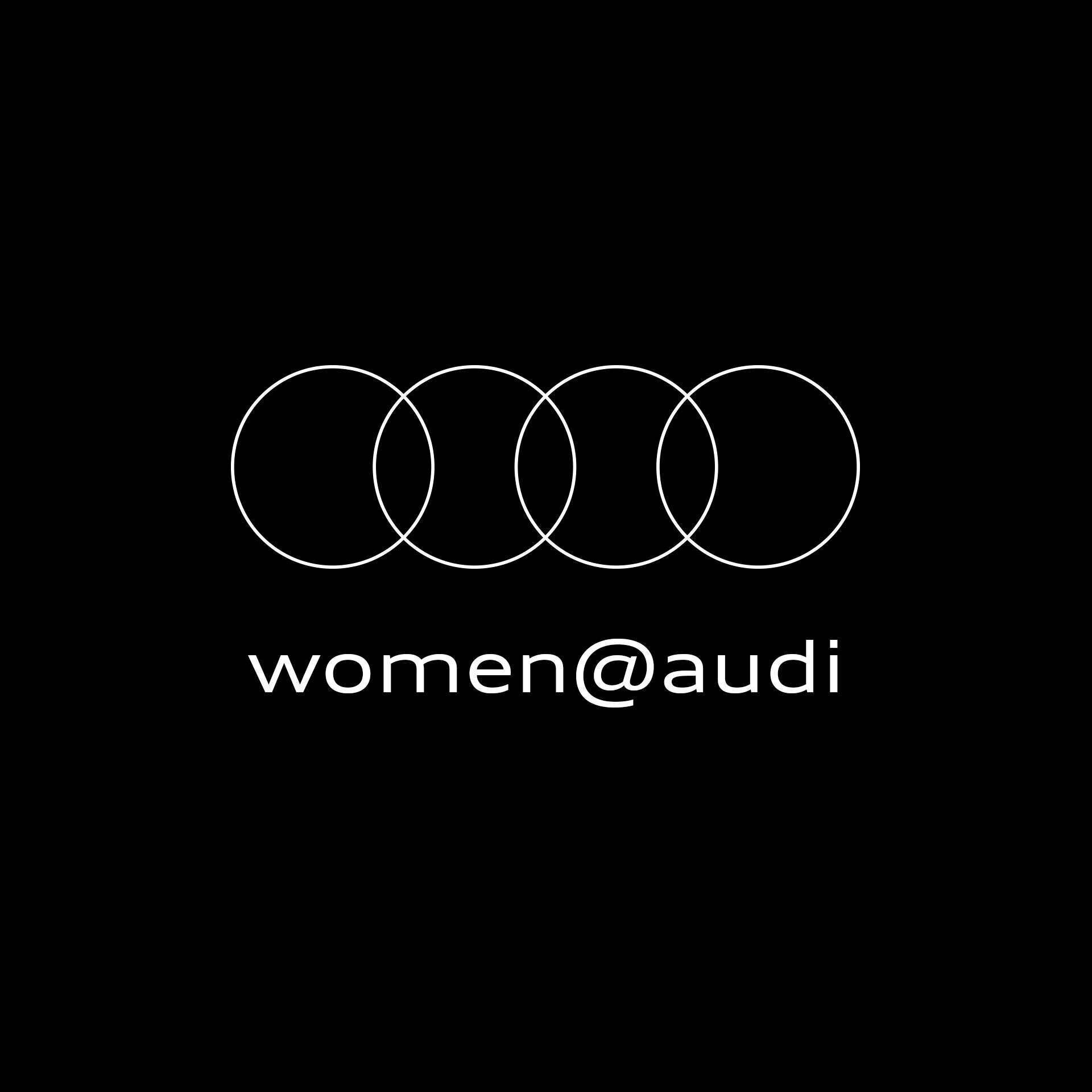 Audi logo with the words “woman@audi” underneath